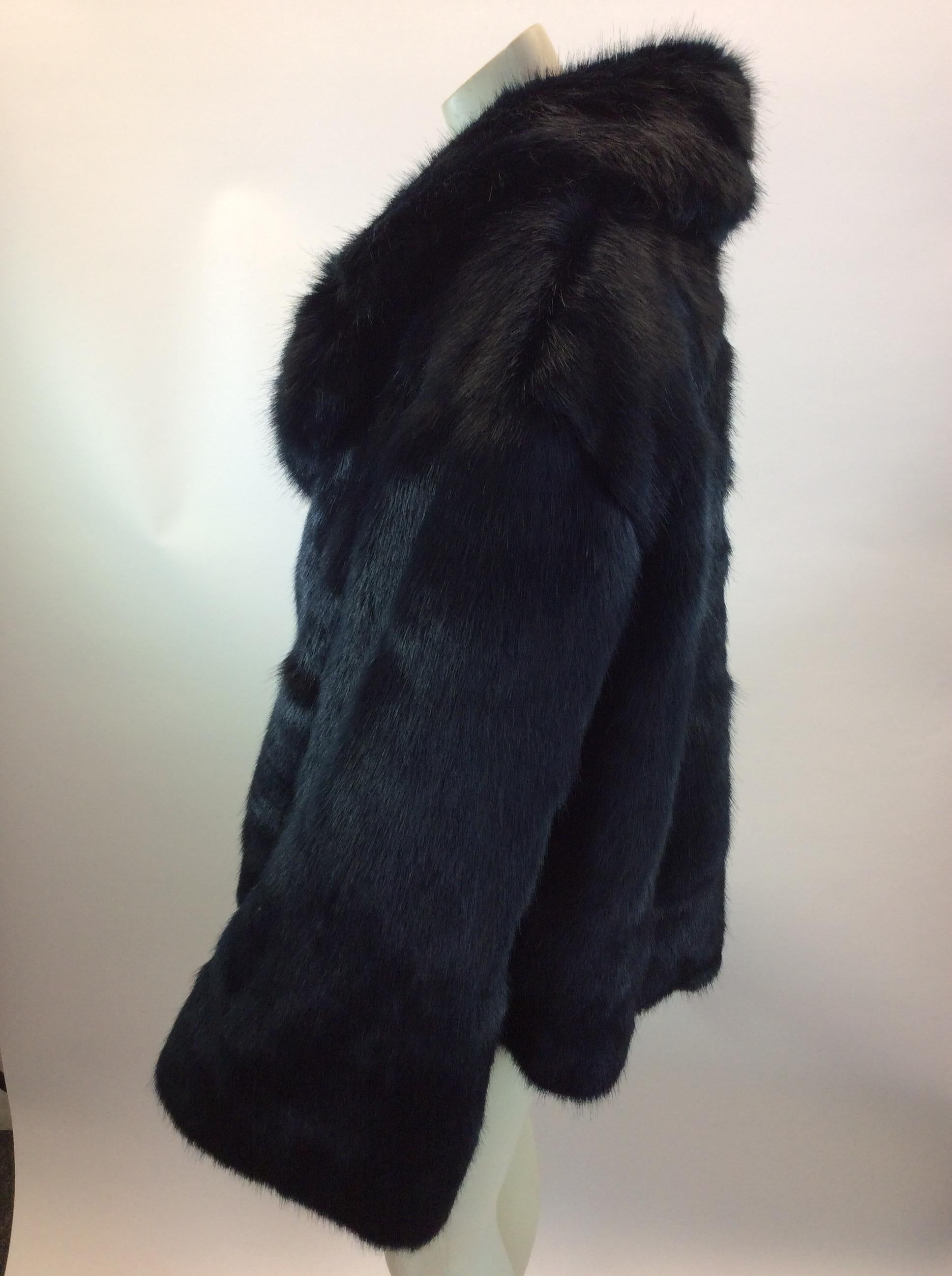 Nili Lotan Black Faux Fur Coat
$599
Hook and eye closure on front
Made in the US
50% Modacrylic, 50% Acrylic
Size Small
Length 24”
Bust 48”
Waist 51”