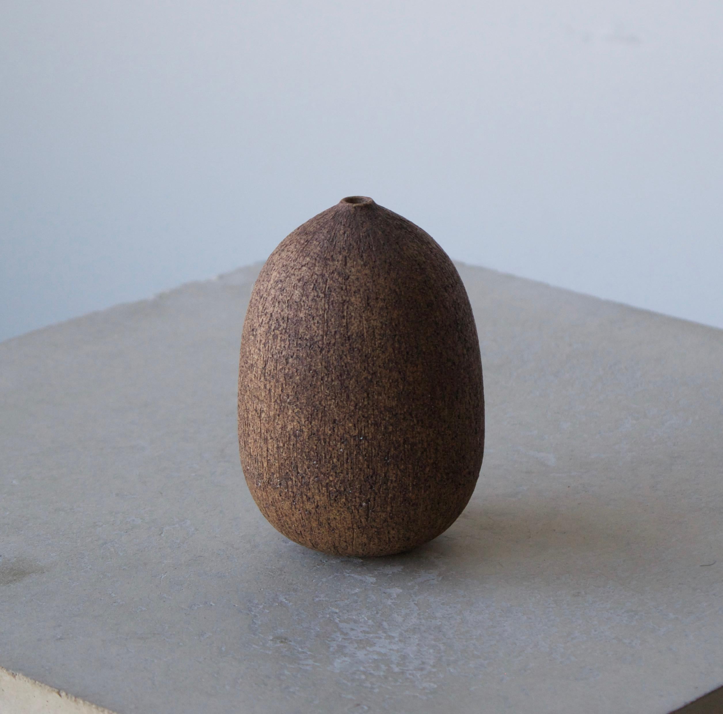 A small vase designed and produced by Nils Allan Johannesson, in his own studio in Barsebäck, Sweden. c. 1960s-1970s. 

Features brown colored stoneware. With markings to underside. 

