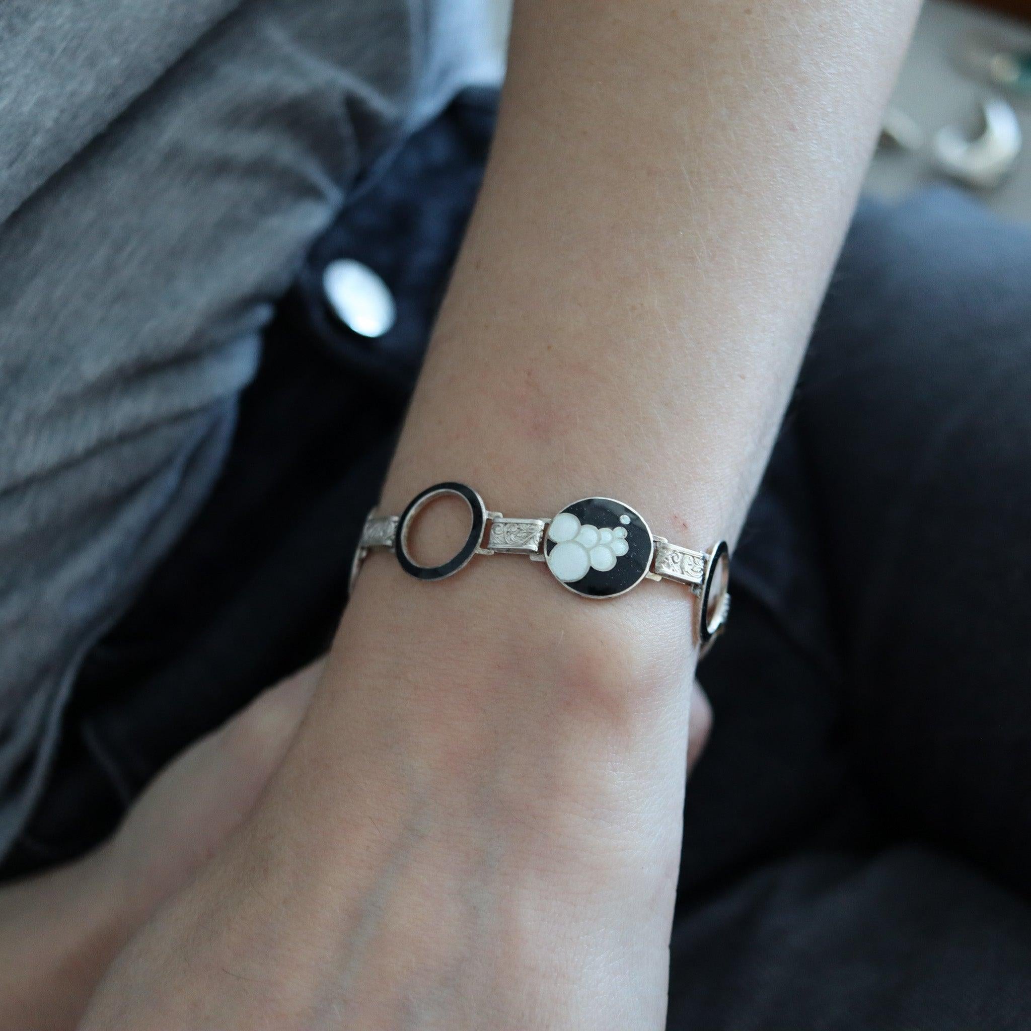An art-deco bracelet designed by Nils Erik Elvik (1853-1935).

This a beautiful bracelet created in Oslo Norway by Nils Erik Elvik, back in 1930. The bracelet was crafted with bubbles geometric patterns in solid sterling silver and fitted with a