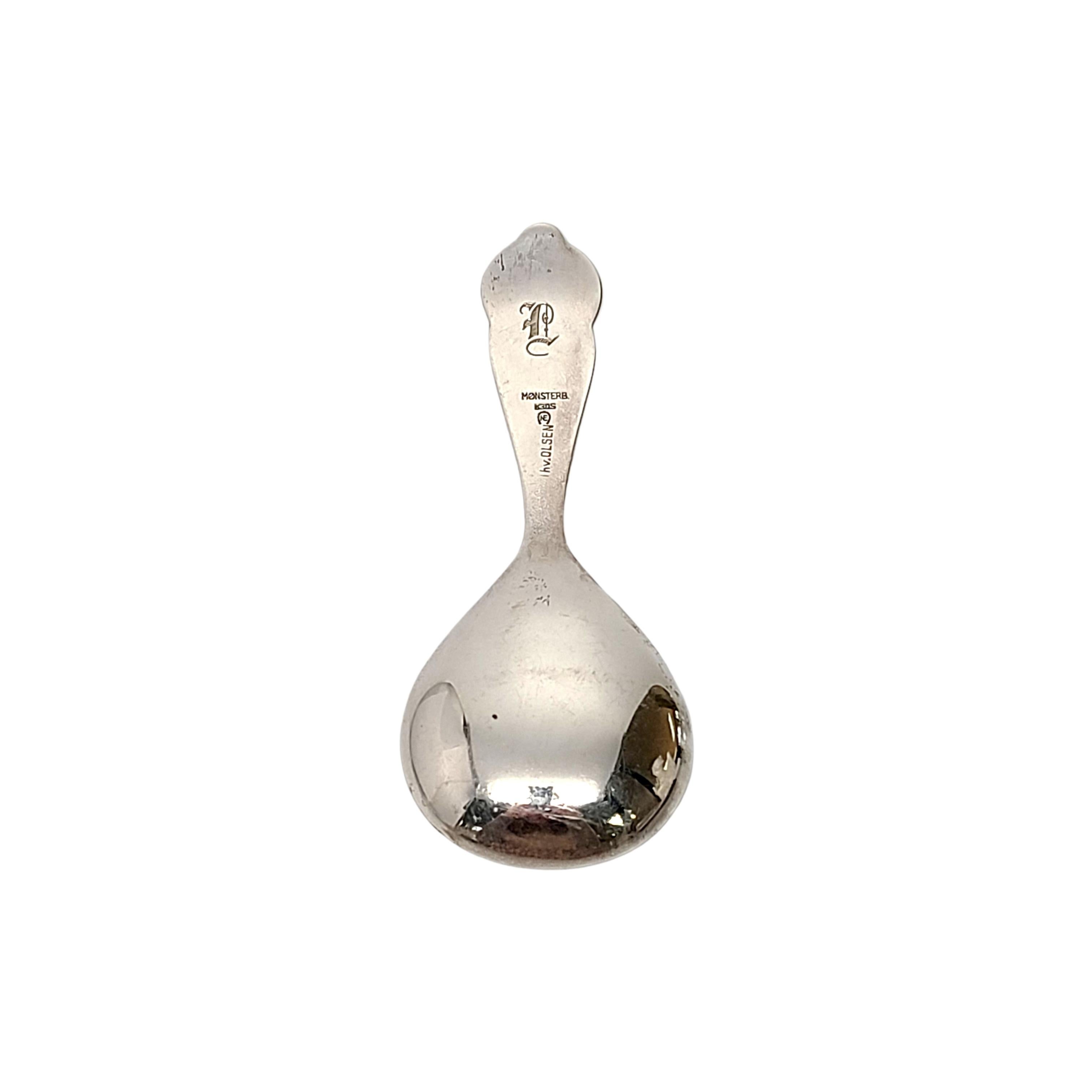 830 silver tea caddy spoons by Nils Erik Elvik of Oslo, Norway.

Monogram on the back of the handle appears to be L

A simple and timeless floral design with dotted edge.

Measures 4 1/8