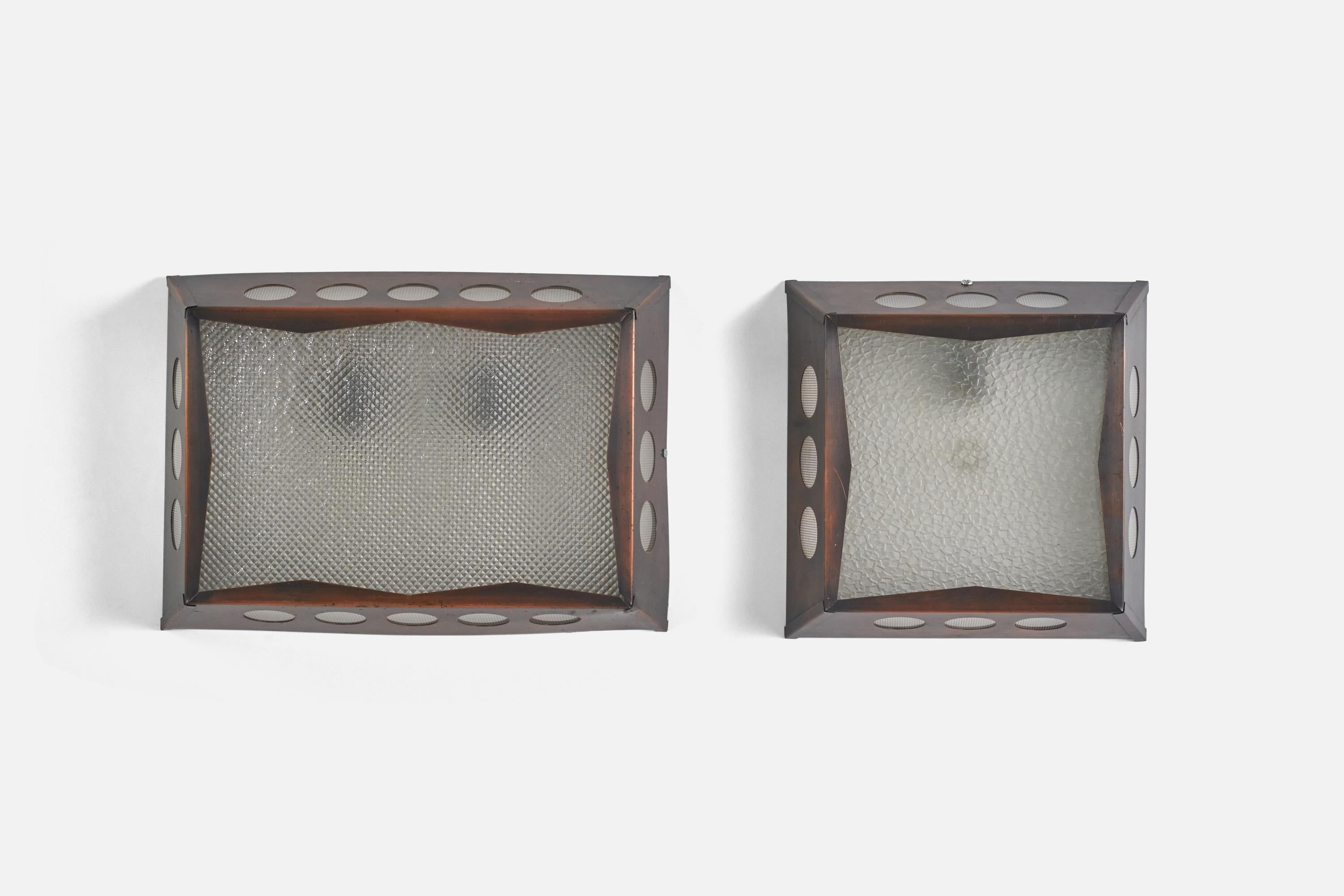 A pair of copper and glass sconces / wall lights designed and produced by Nils H. Ledung, Sweden, 1960s.

Socket takes standard E-26 medium base bulb.

There is no maximum wattage stated on the fixture.

Measurements listed are of Largest