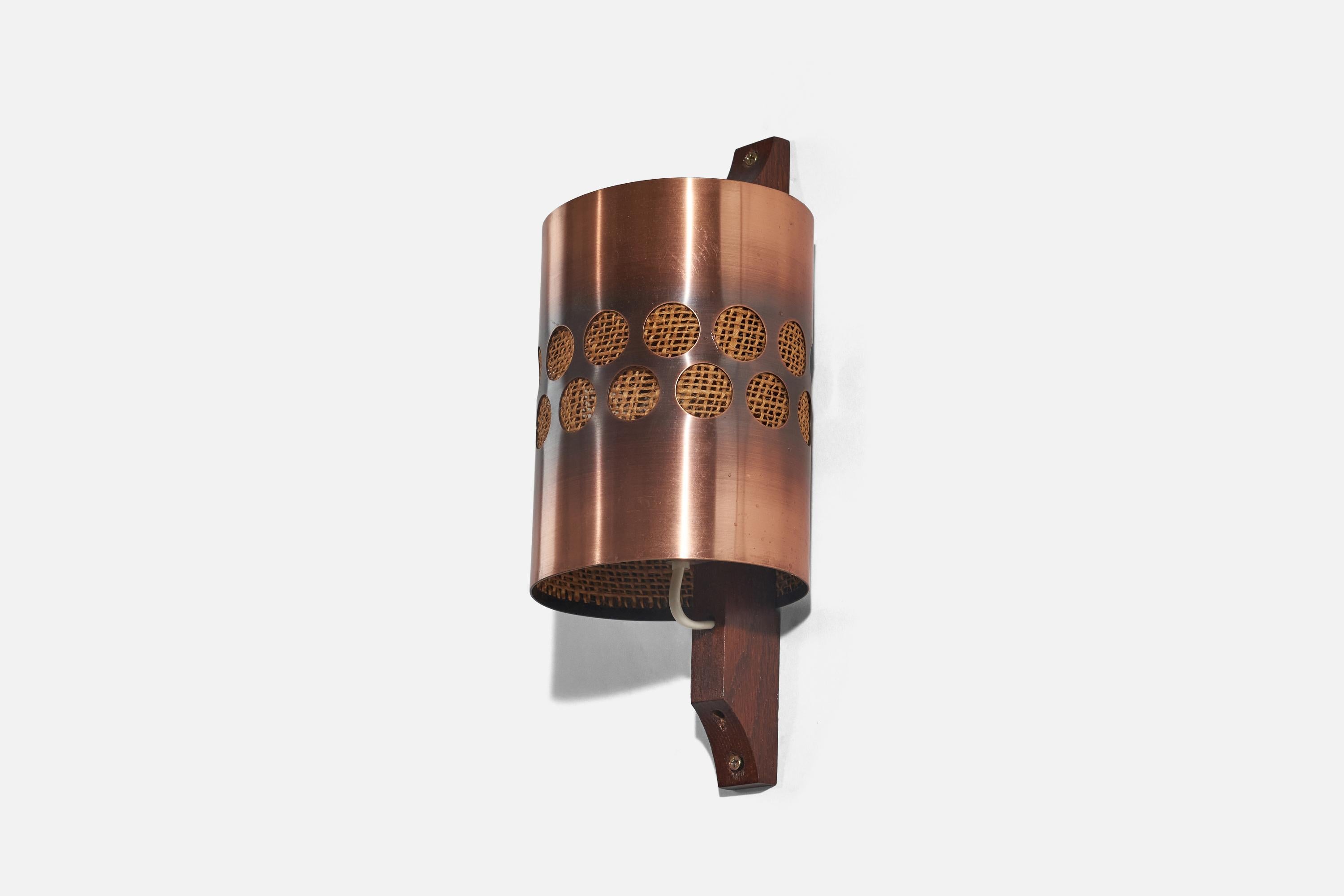 An oak, copper and raffia wall light designed and produced by Nils H. Ledung, Sweden, 1960s.

Fixture is set as a hardwire or plug-in. 
Socket takes E-14 bulb.
There is no maximum wattage stated on the fixture. 