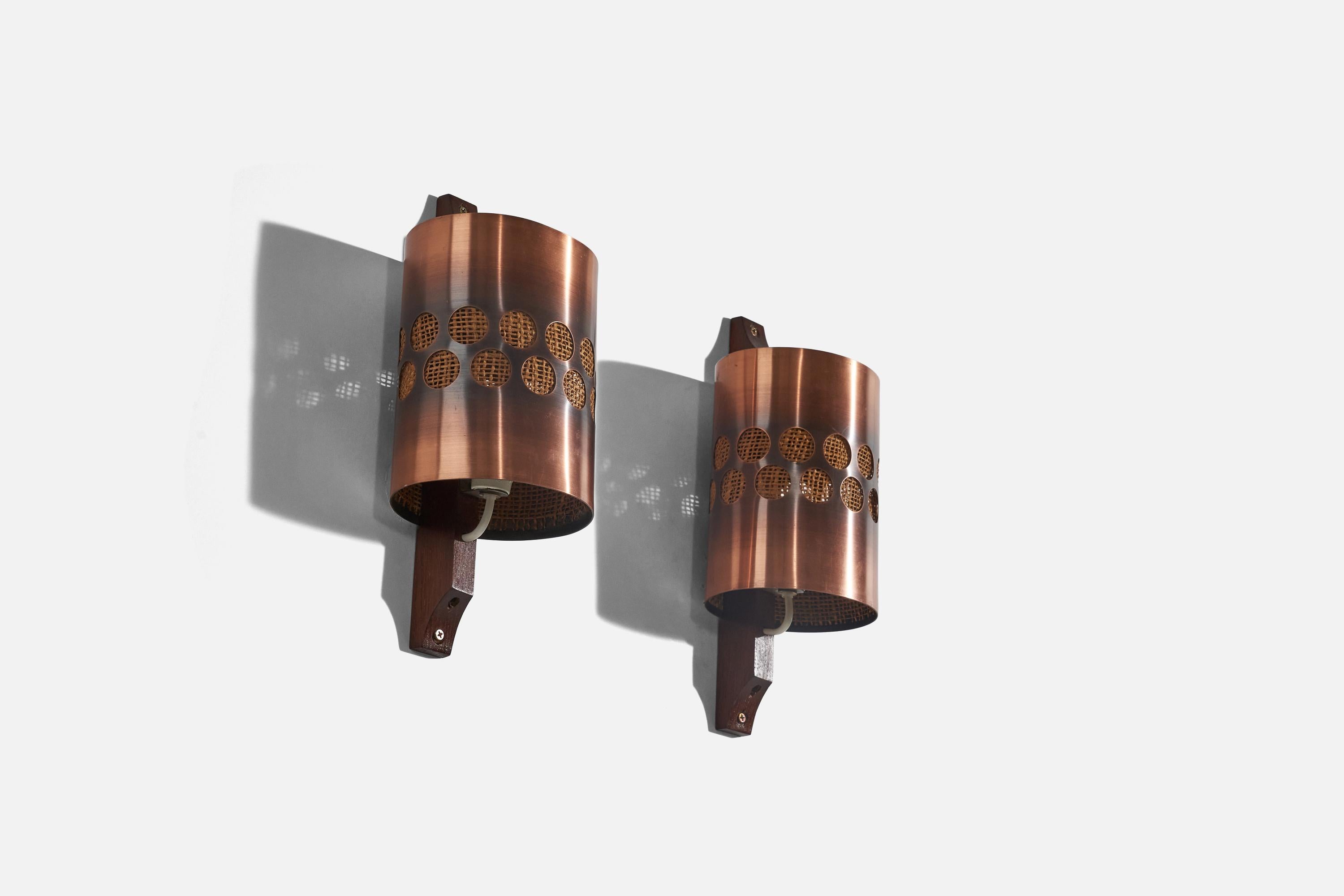 A pair of oak, copper and raffia wall lights designed and produced by Nils H. Ledung, Sweden, 1960s.

Fixture is set as a hardwire or plug-in. 
Socket takes E-14 bulb.
There is no maximum wattage stated on the fixture. 