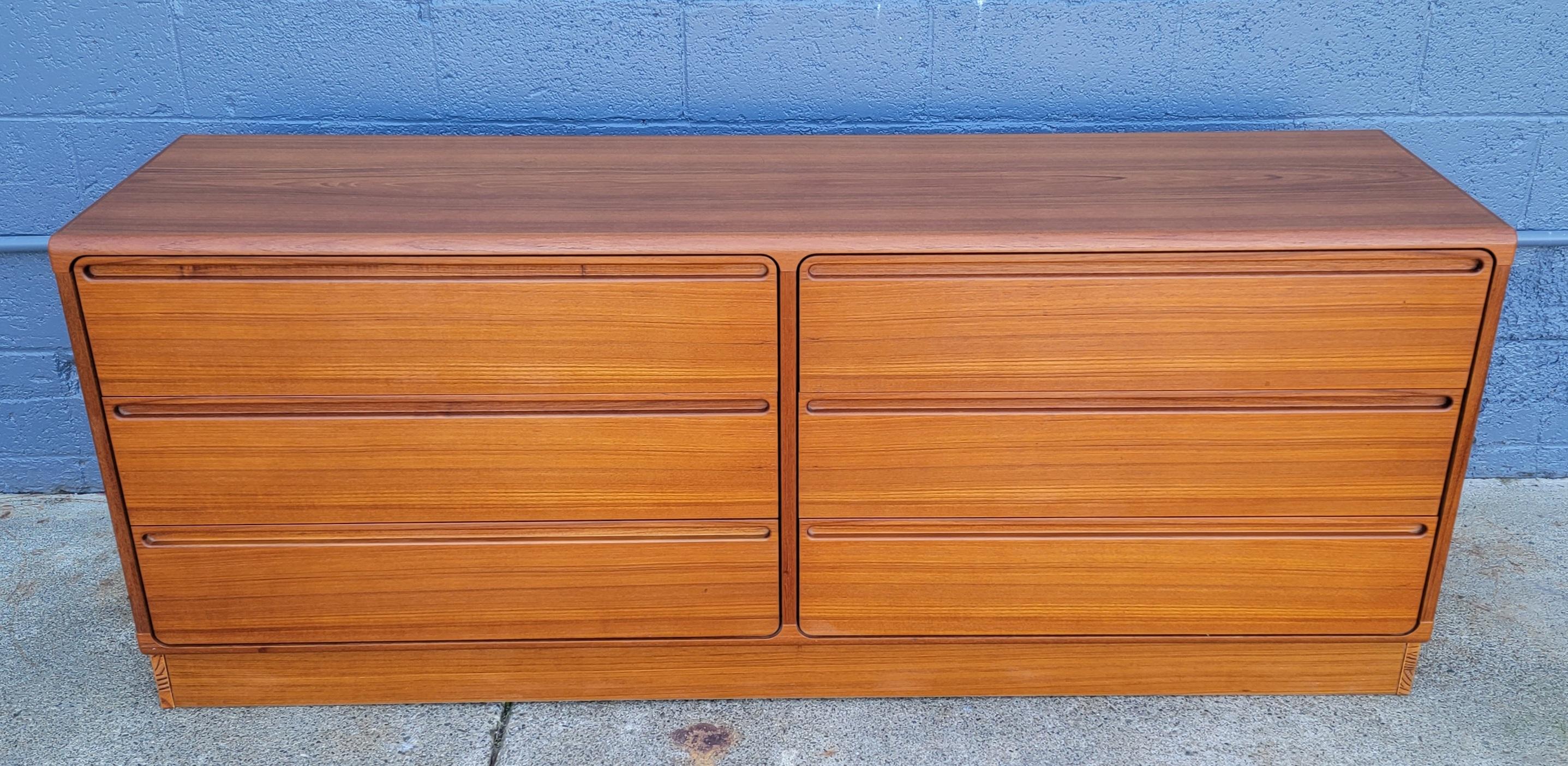 Fine teak Danish Modern dresser designed by Nils Jonsson for Torring Mobelfabrik, Denmark. Excellent original condition with beautiful glow to finish. Six large drawers on metal glides operate very easily. Retains Torring labels.