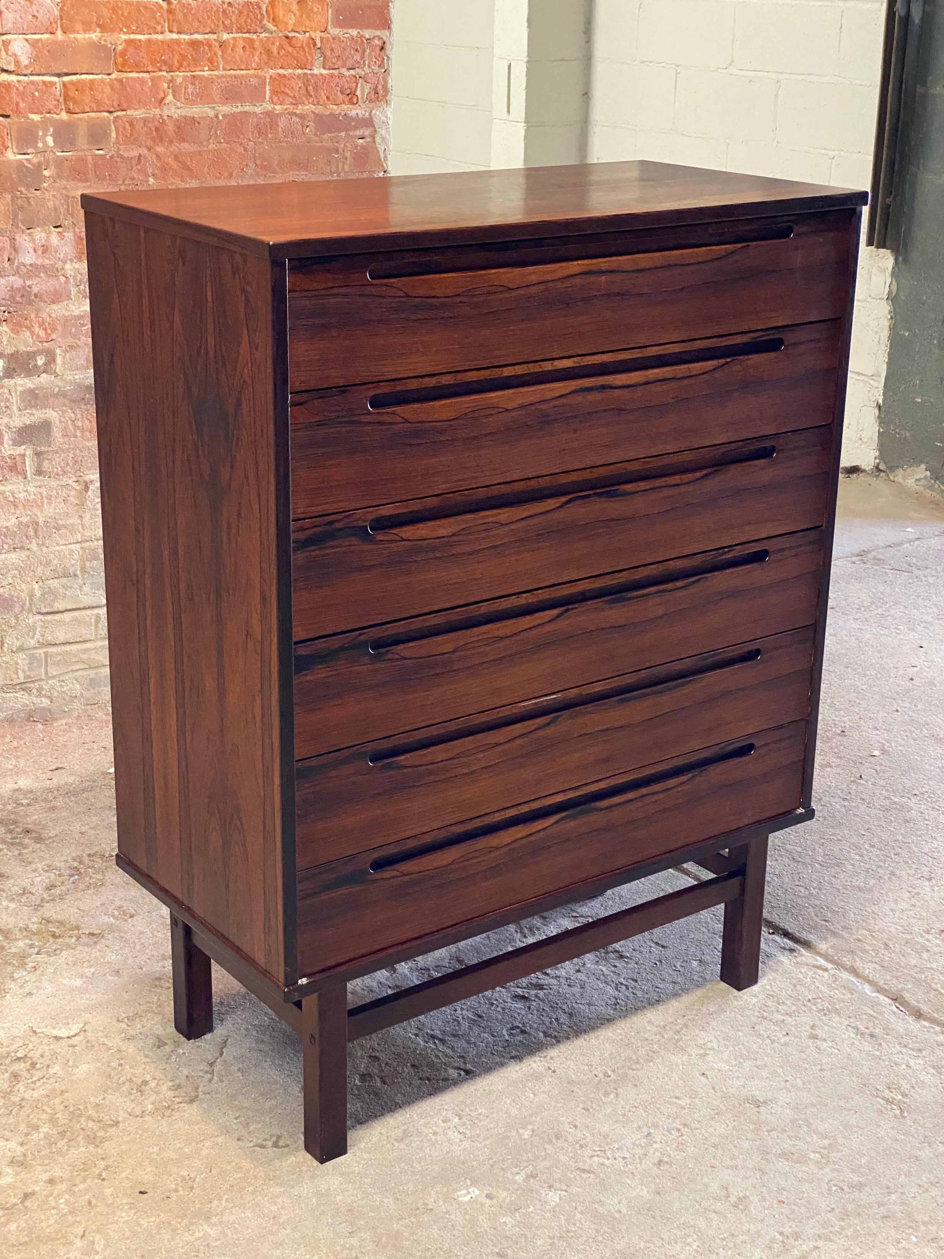 An exceptional Danish Modern six drawer Rosewood dresser designed by Nils Jonsson. Circa 1960. This piece came out of a very distinguished New York City apartment at Gracie Square adjacent Gracie Mansion. Often seen in teak, the Rosewood form is a