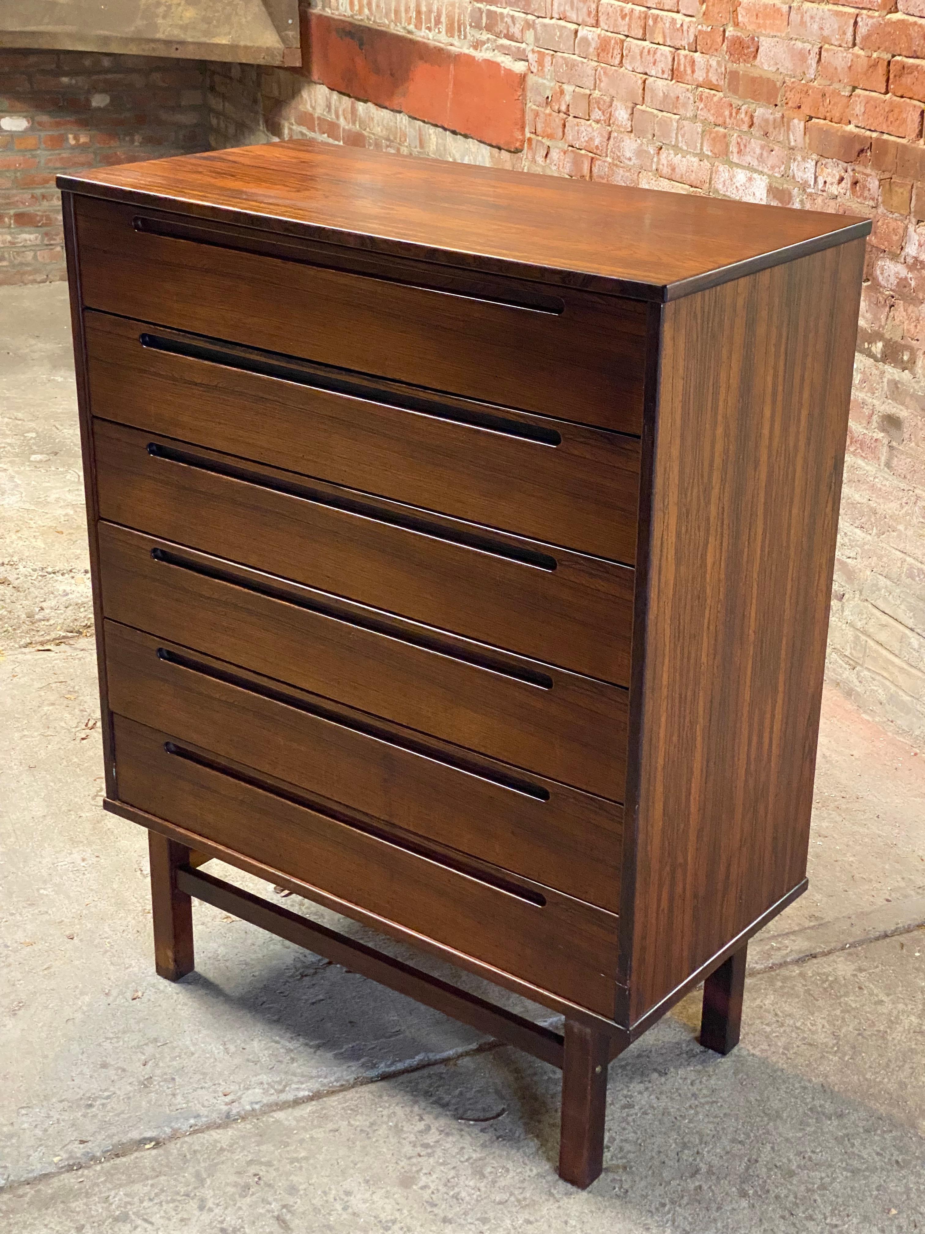 An exceptional Danish Modern six drawer Rosewood dresser designed by Nils Jonsson. Circa 1960-1970. This piece came out of a very distinguished New York City apartment at Gracie Square adjacent Gracie Mansion. Often seen in teak, the Rosewood form