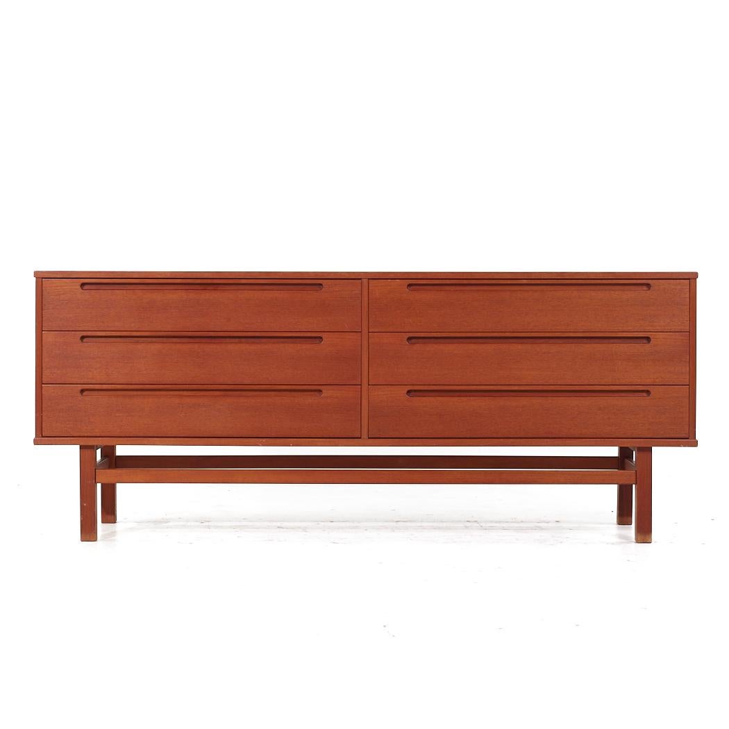Nils Jonsson for Torring Møbelfabrik Mid Century Danish Teak Lowboy Dresser

This lowboy measures: 71 wide x 17.75 deep x 29 inches high

All pieces of furniture can be had in what we call restored vintage condition. That means the piece is restored