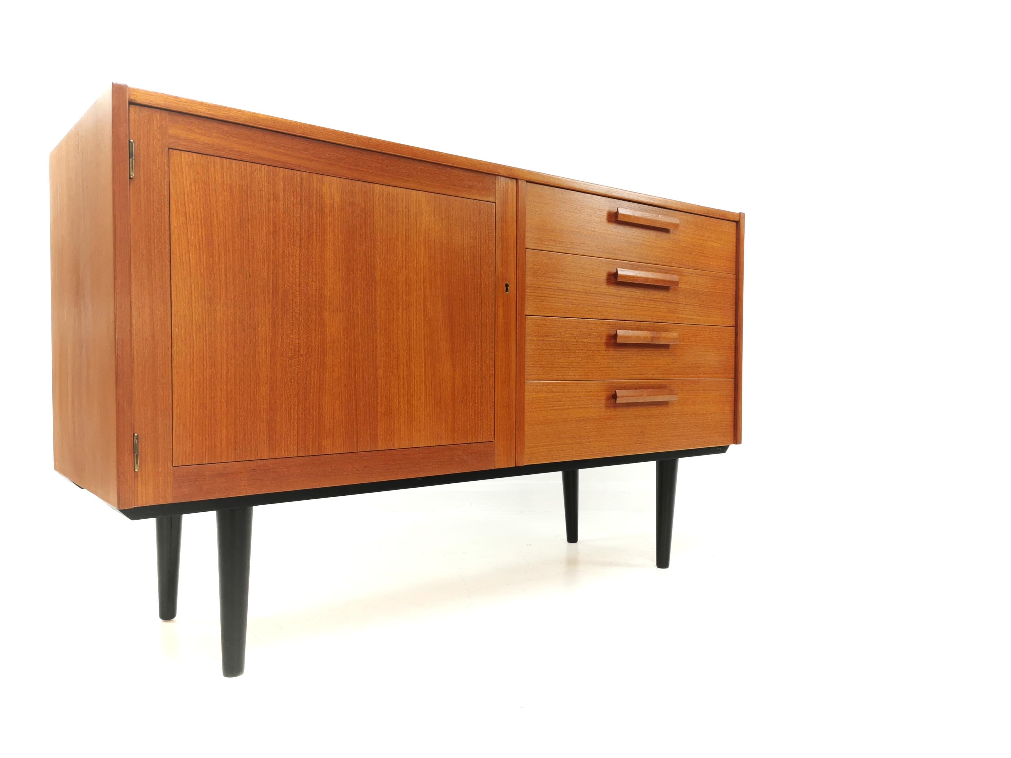 Bjarnum sideboard by Nils Jonsson for Troeds.
Raised on ebonized timber legs and featuring 4 drawers and lockable cupboard space.
High quality. Made from teak. Made in Sweden.