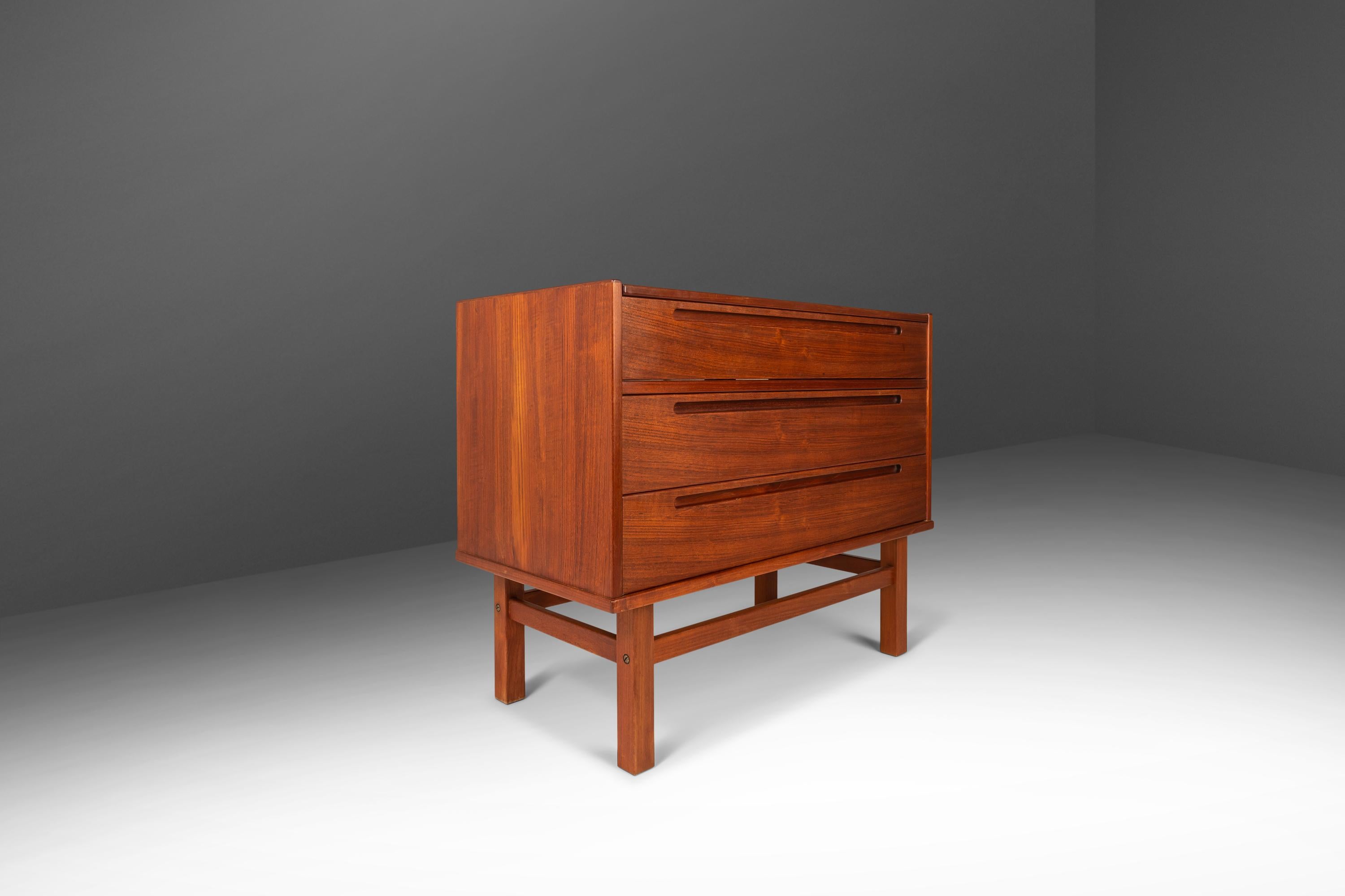 Introducing a true Danish Modern marvel: a rare three-in-one vanity designed by the influential Nils Jonsson for Torring Møbelfabrik. Save for a small veneer repair this exquisite dresser is in original, vintage condition making it the perfect