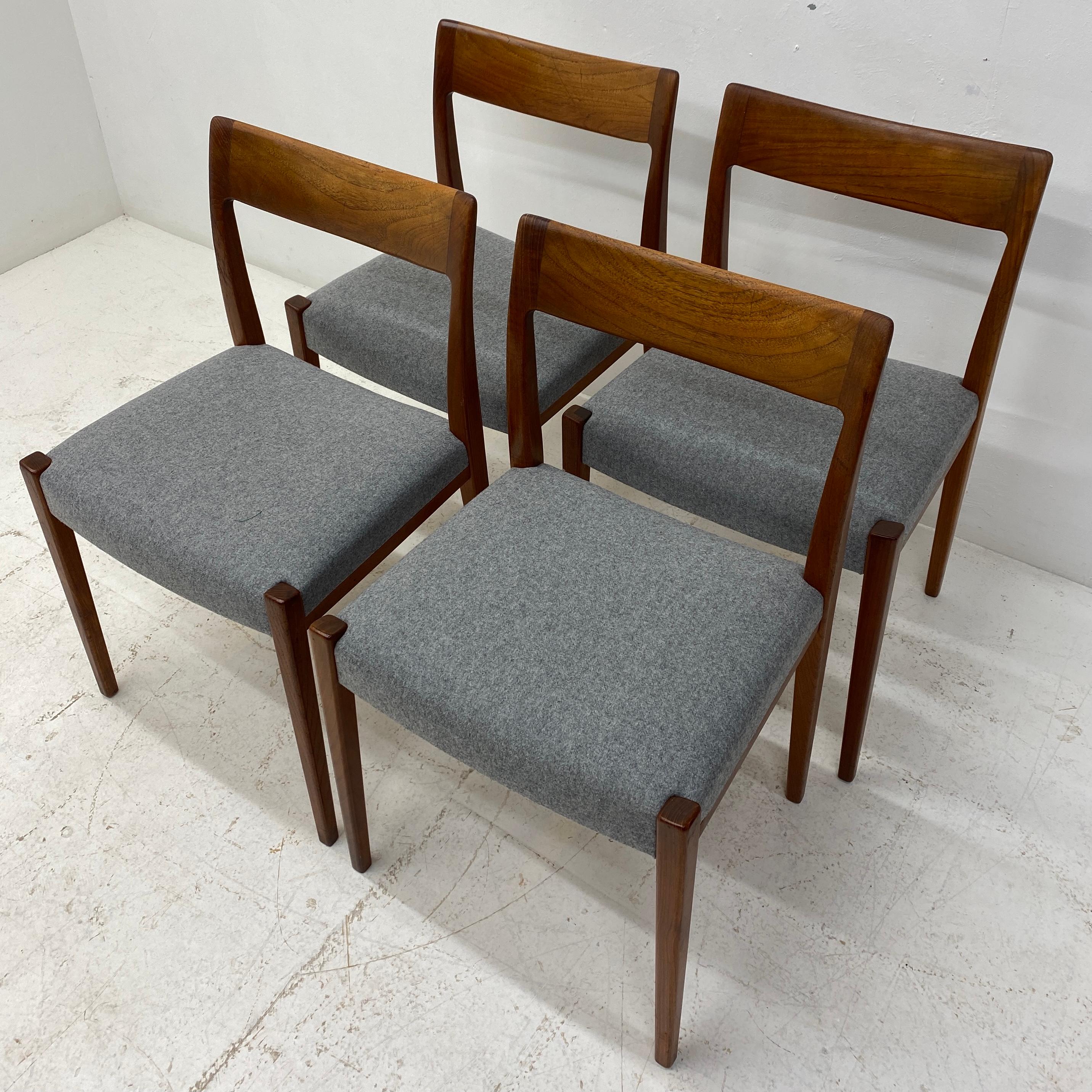 A stunning set of four Swedish Nils Jonsson dining chairs circa 1960s model Garmi. The dining chairs are in teak to the backrest, frame & legs. And have been professionally reupholstered in grey Abraham Moon wool fabric. The dining chairs are a