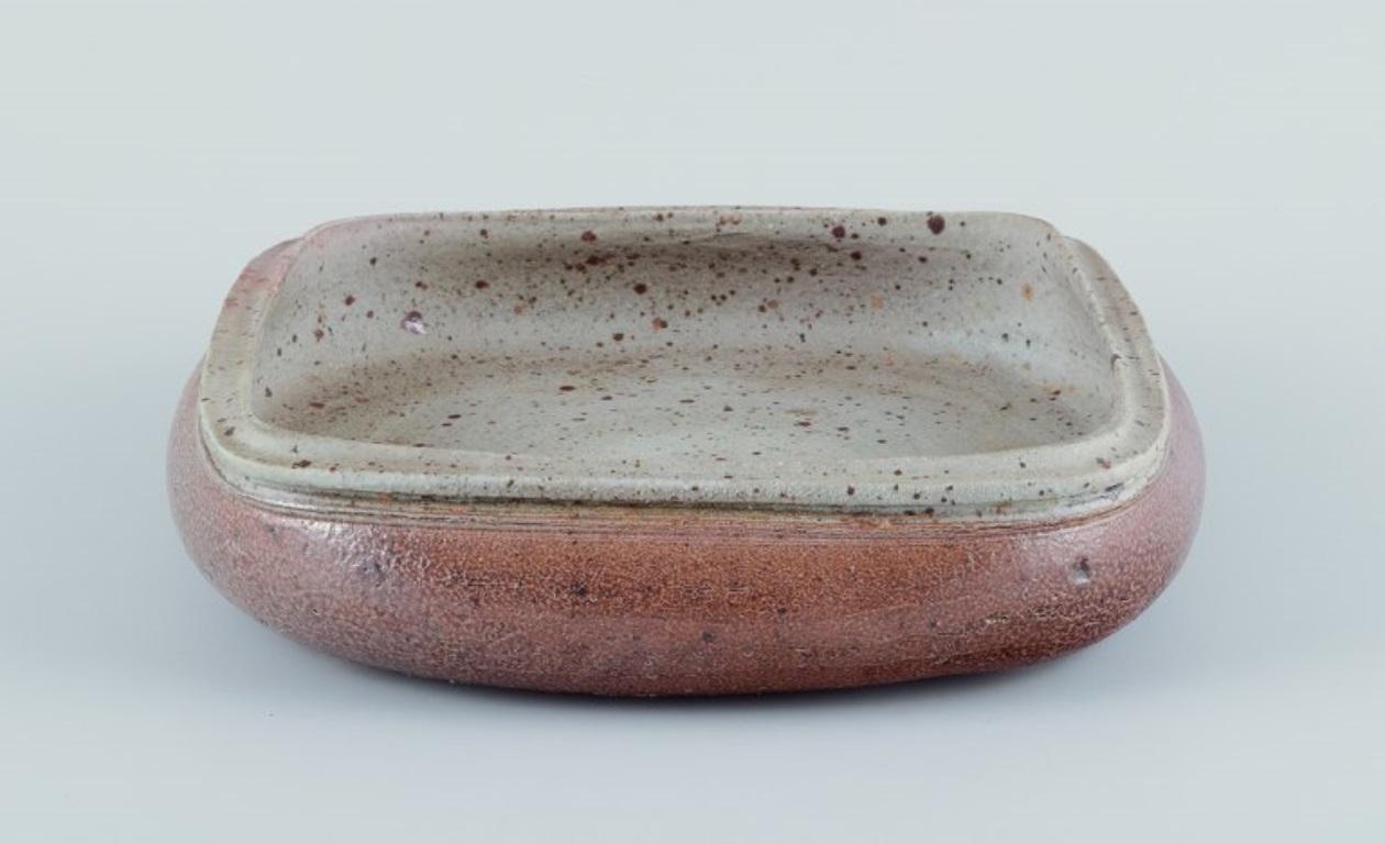 Scandinavian Modern Nils Kähler for Kähler, ceramic bowl on four low feet. Square shape. For Sale