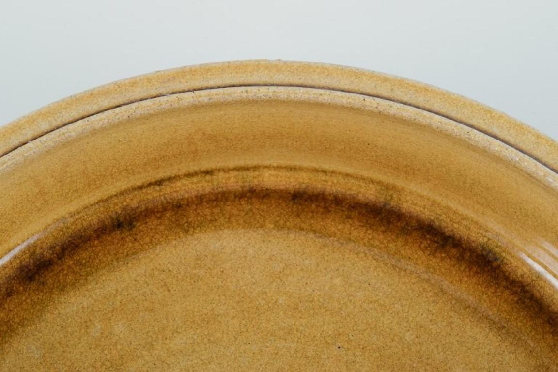 Nils Kähler for Kähler. Large ceramic bowl with uranium yellow glaze. In Excellent Condition For Sale In Copenhagen, DK
