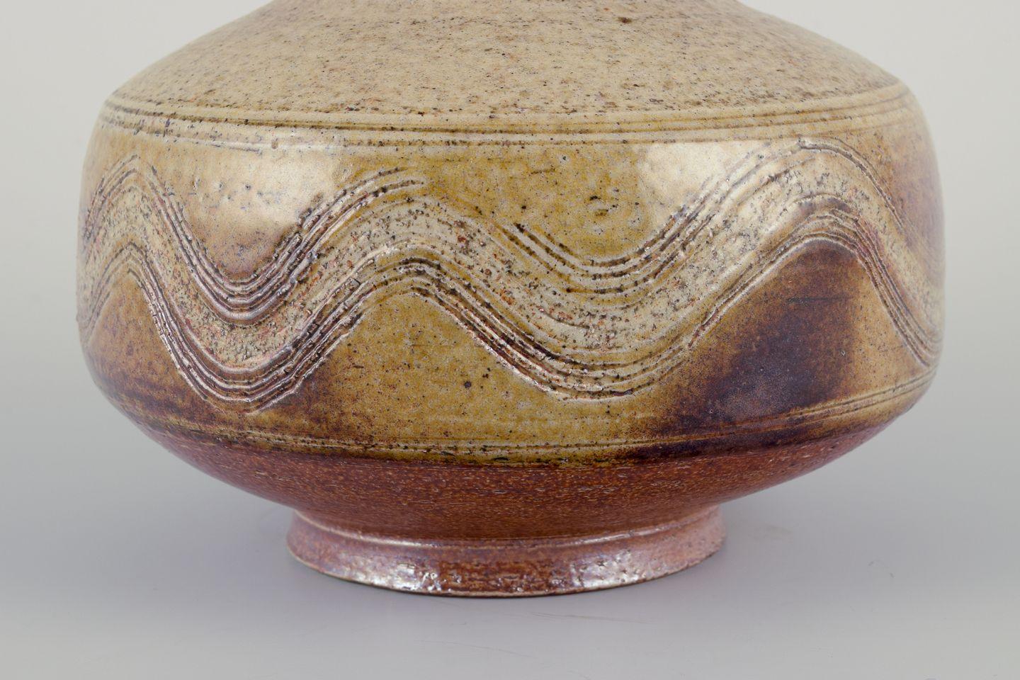 Danish Nils Kähler for Kähler. Modernist ceramic vase. Glaze in brown and sandy tones. For Sale