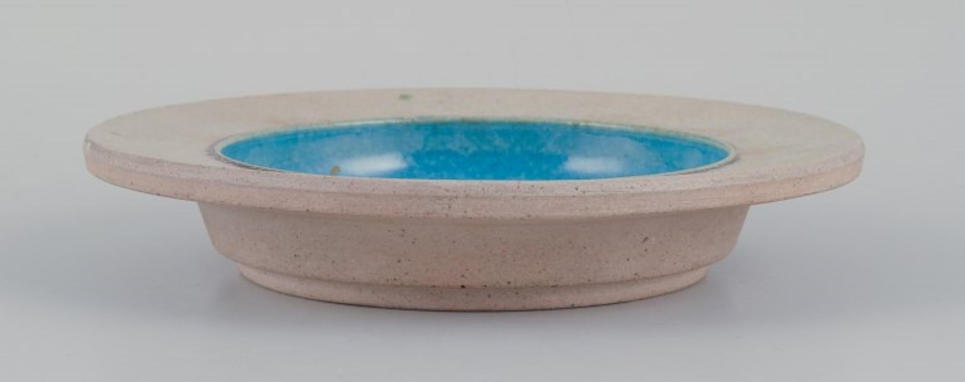 Scandinavian Modern Nils Kähler for Kähler. Three ceramic bowls. Sand-colored and turquoise glaze. For Sale
