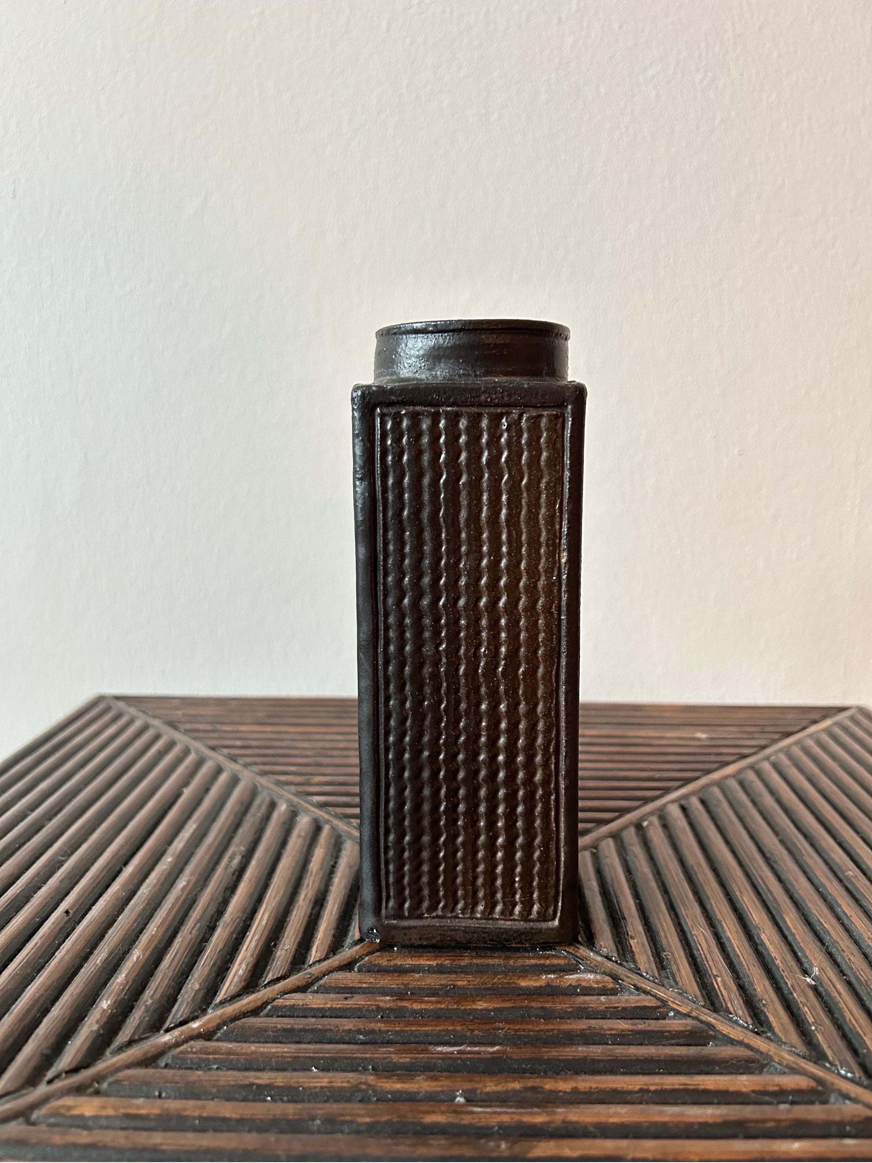 Rare square vase designed by Nils Kähler and made at the Kähler workshop in the 1950s in a dark brown and reddish glaze.

Kähler Keramik is a Danish ceramic company, originally from Næstved.
Kähler's ceramics started with the production of tiled
