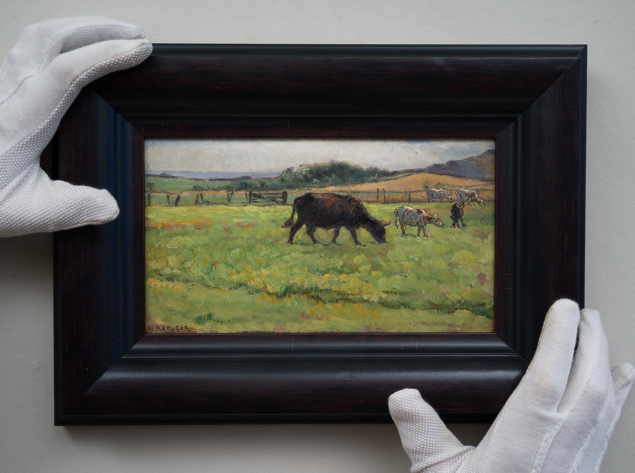 This exquisite oil painting on panel, measuring 13.5 x 24.5 cm, is a beautiful piece by Nils Kreuger, a distinguished Swedish painter. The artwork depicts five cattle grazing on a green meadow, a scene that encapsulates the tranquil beauty of rural