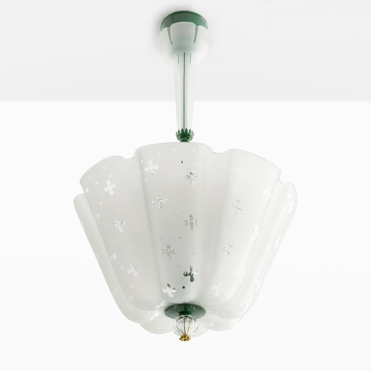 Nils Landberg designed chandelier for Orrefors, Sweden, circa 1940s. The fixture has an acid etched, soft undulating form outer shade with an overall polished clear glass pattern. The inner clear glass shade hold 3 standard base light sockets. The