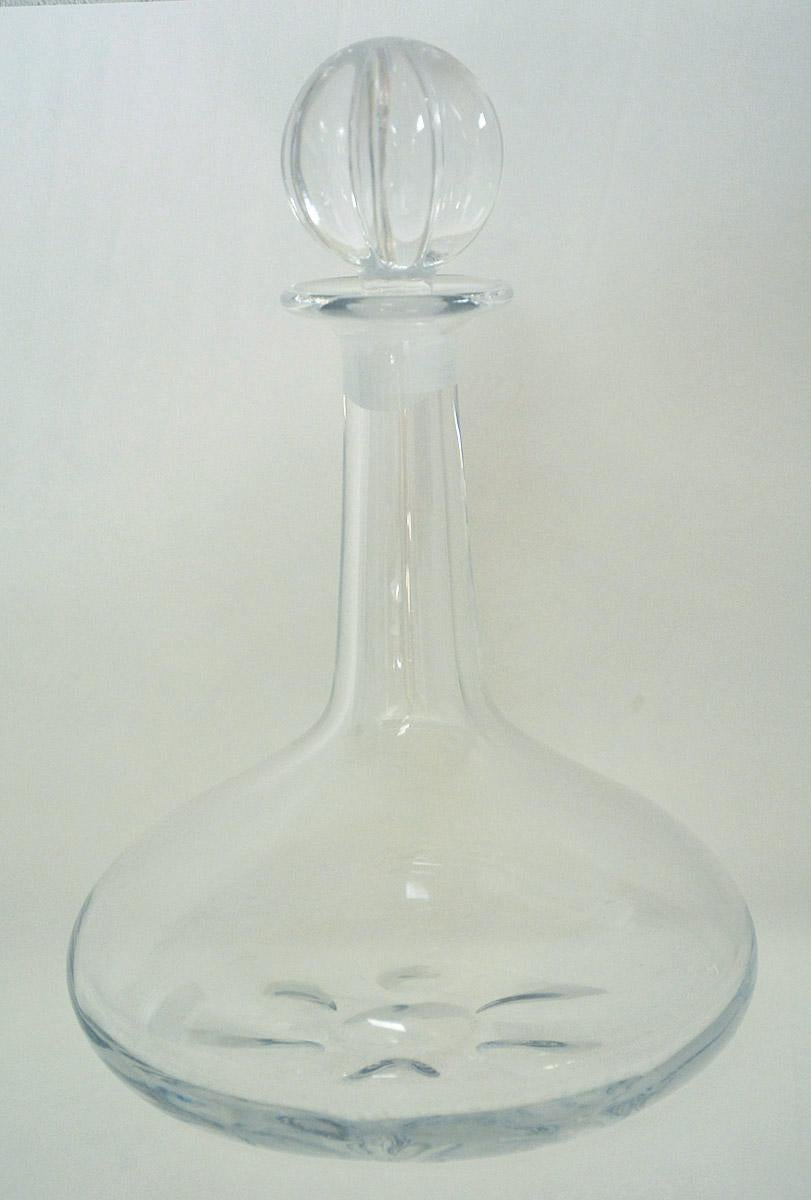 Heavy crystal ship decanter by Nils Landberg for Orrefors, number 4200-731. The shape of the decanter, with the weight being spread out at the base, is designed to not tip over on a ship when the waves jostle the ship. Signed.
Some fogging.
OFFERING
