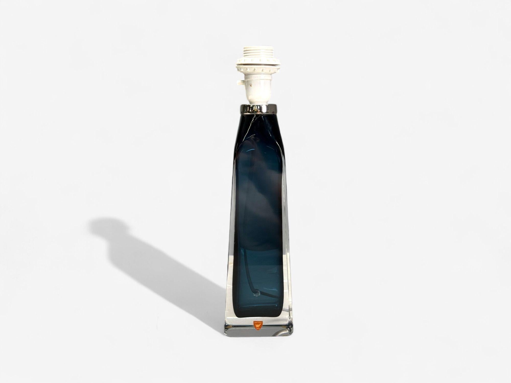 Nils Landberg, Swedish Modern, Blue Tinted Glass, Table Lamp, Sweden, 1960s

A single Swedish modern blue glass and chrome bottle form table lamp designed by Nils Landberg, for Orrefors in Sweden c. 1960s.

Glass, Chrome; Sweden c. 1960s

Height: