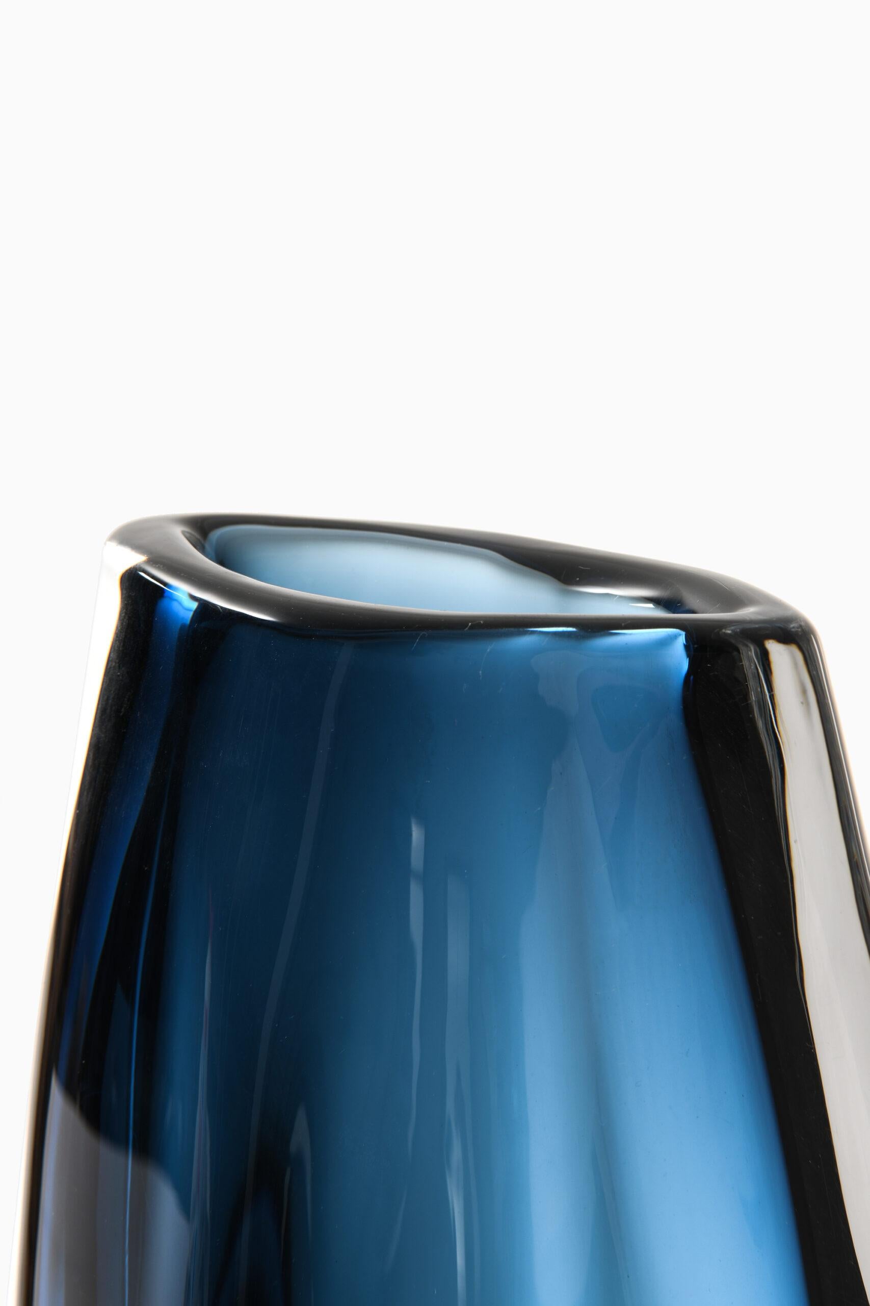Rare and large glass vase designed by Nils Landberg. Produced by Orrefors in Sweden. Signed ‘Orrefors expo -63 Landberg’.