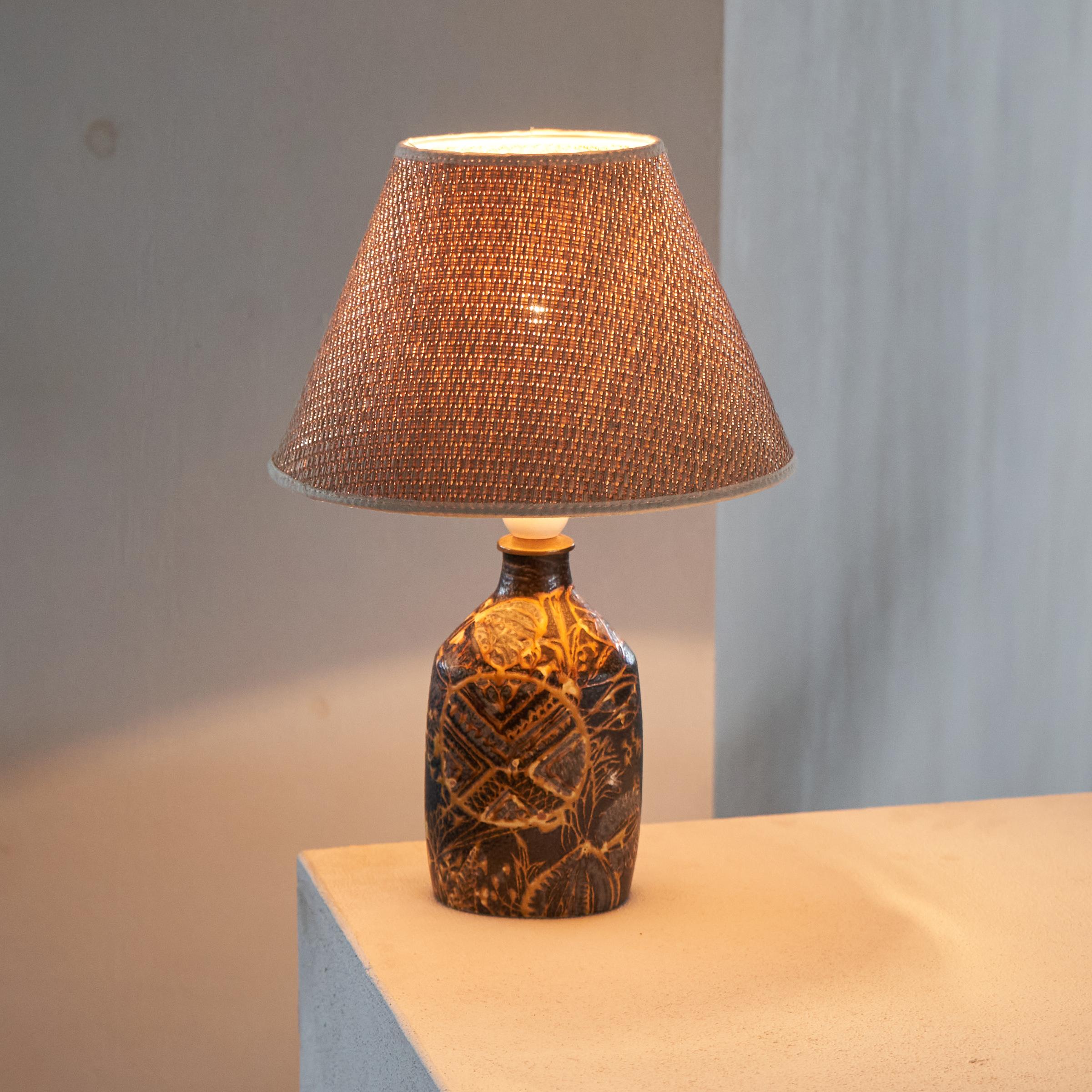 Nils Thorsson 'Baca' Table Lamp for Royal Copenhagen, Denmark, 1960s.

This is a wonderful and quintessentially mid century Scandinavian table lamp by Nils Thorsson for Royal Copenhagen. Nice patterned and graphical glaze in brown. Lovely high