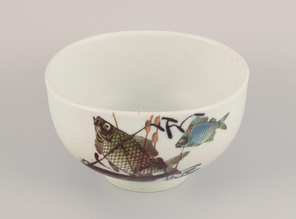 Nils Thorsson for Royal Copenhagen. Faience bowl with fish motifs.
Dating: 1975-1979.
Perfect condition.
First factory quality.
Marked.
Dimensions: Diameter 17.0 cm x Height 10.0 cm.
