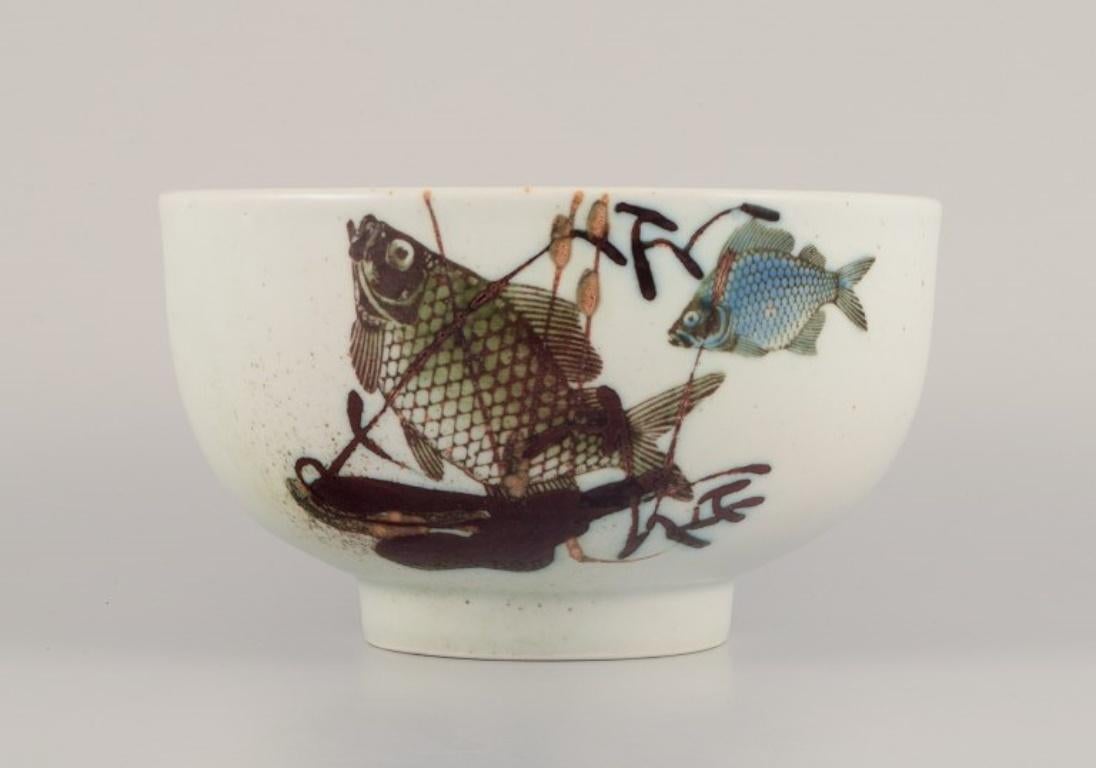 Danish Nils Thorsson for Royal Copenhagen. Faience bowl with fish motifs.  For Sale
