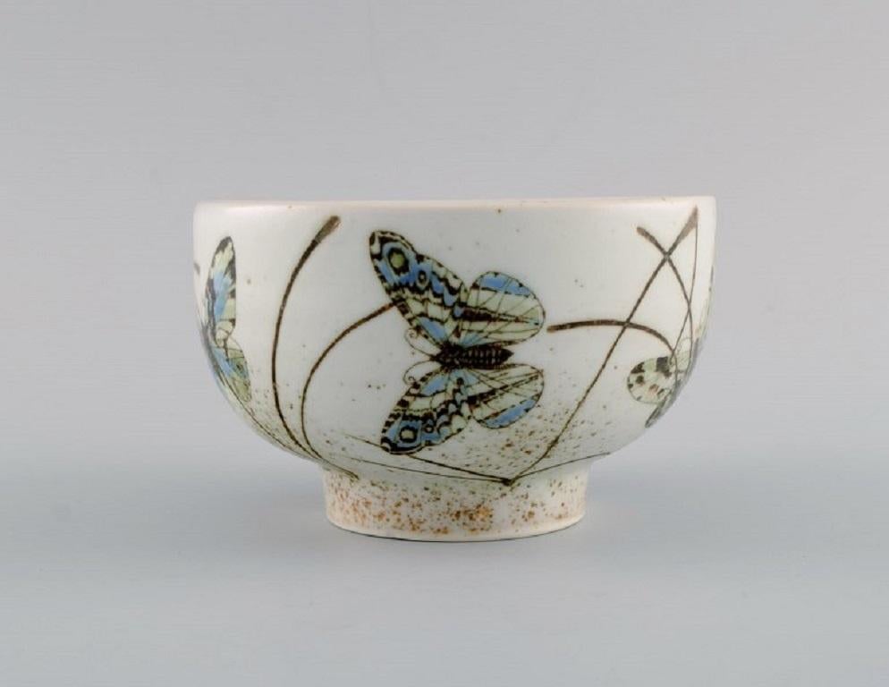 Nils Thorsson for Royal Copenhagen. 
Rare bowl in glazed faience decorated with butterflies. 
1970s.
Measures: 14 x 8 cm.
In excellent condition.
Stamped.
1st factory quality.