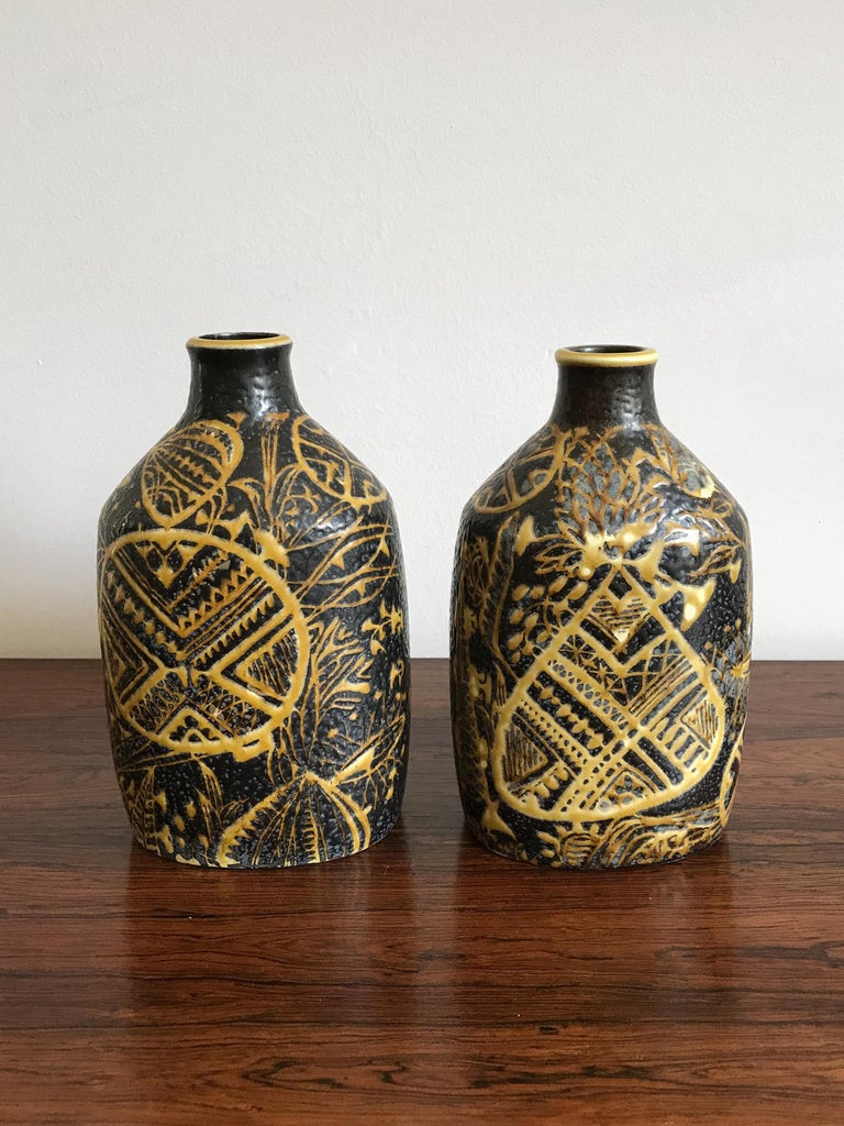 Couple of Scandinavian ceramic vases designed by Nils Thorsson for Royal Copenhagen with mark printed on the bottom, Denmark circa 1960s.
Marked on the bottom.

Please note that the vases are original of the period and this shows normal signs of