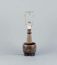Nils Thorsson for Royal Copenhagen. Table lamp in stoneware with a motif of fish