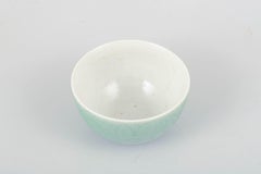 Nils Thorsson, Royal Copenhagen. Small bowl in celadon glaze with relief pattern