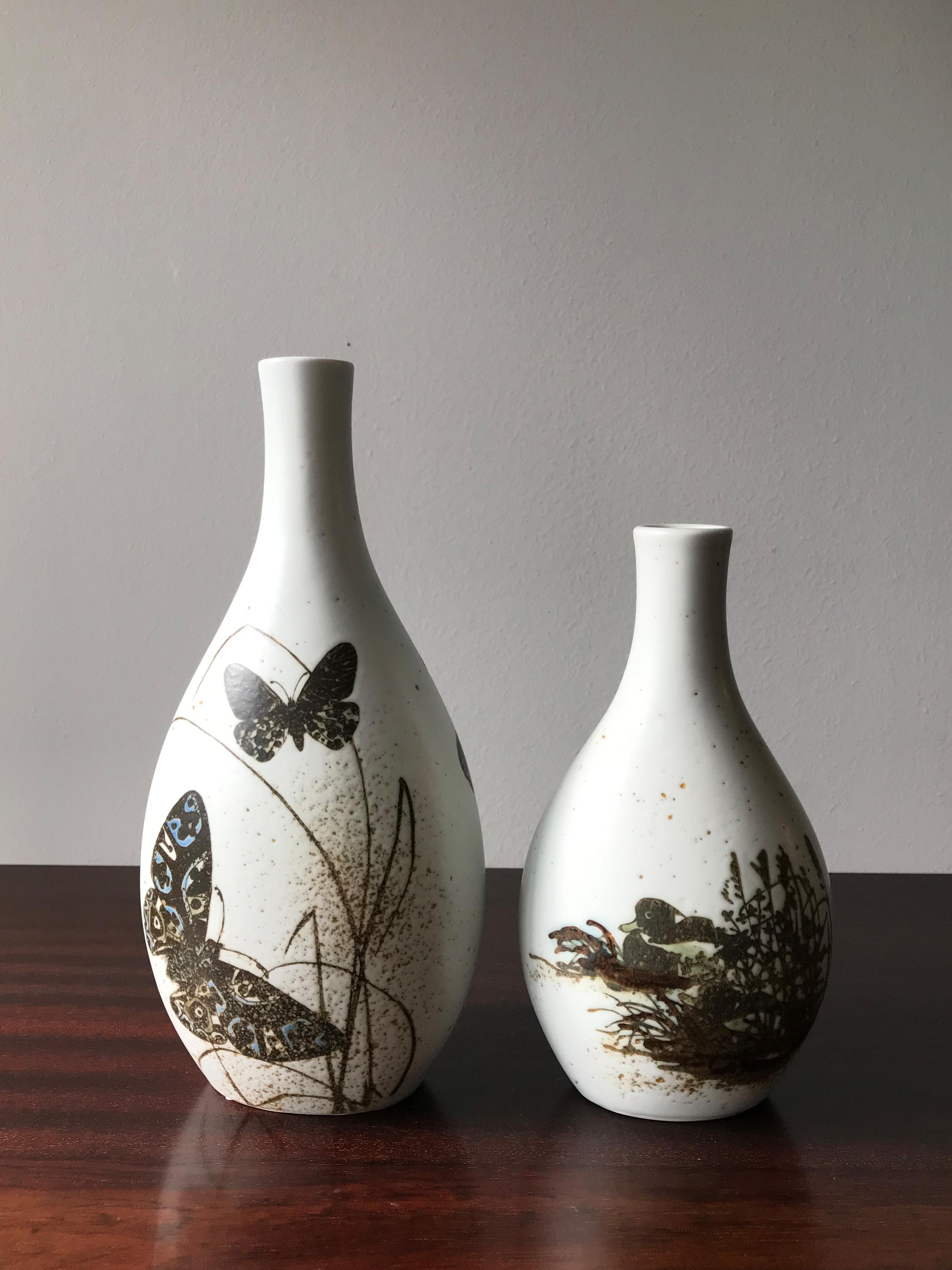 Set of two Danish ceramic vases designed by Nils Thorsson and produced by Royal Copenhagen from 1960s, made in Denmark.
Measurements from the left:
height 24 cm - width 12 cm - depth 8 cm
height 19 cm - width 11 cm - depth 7 cm.