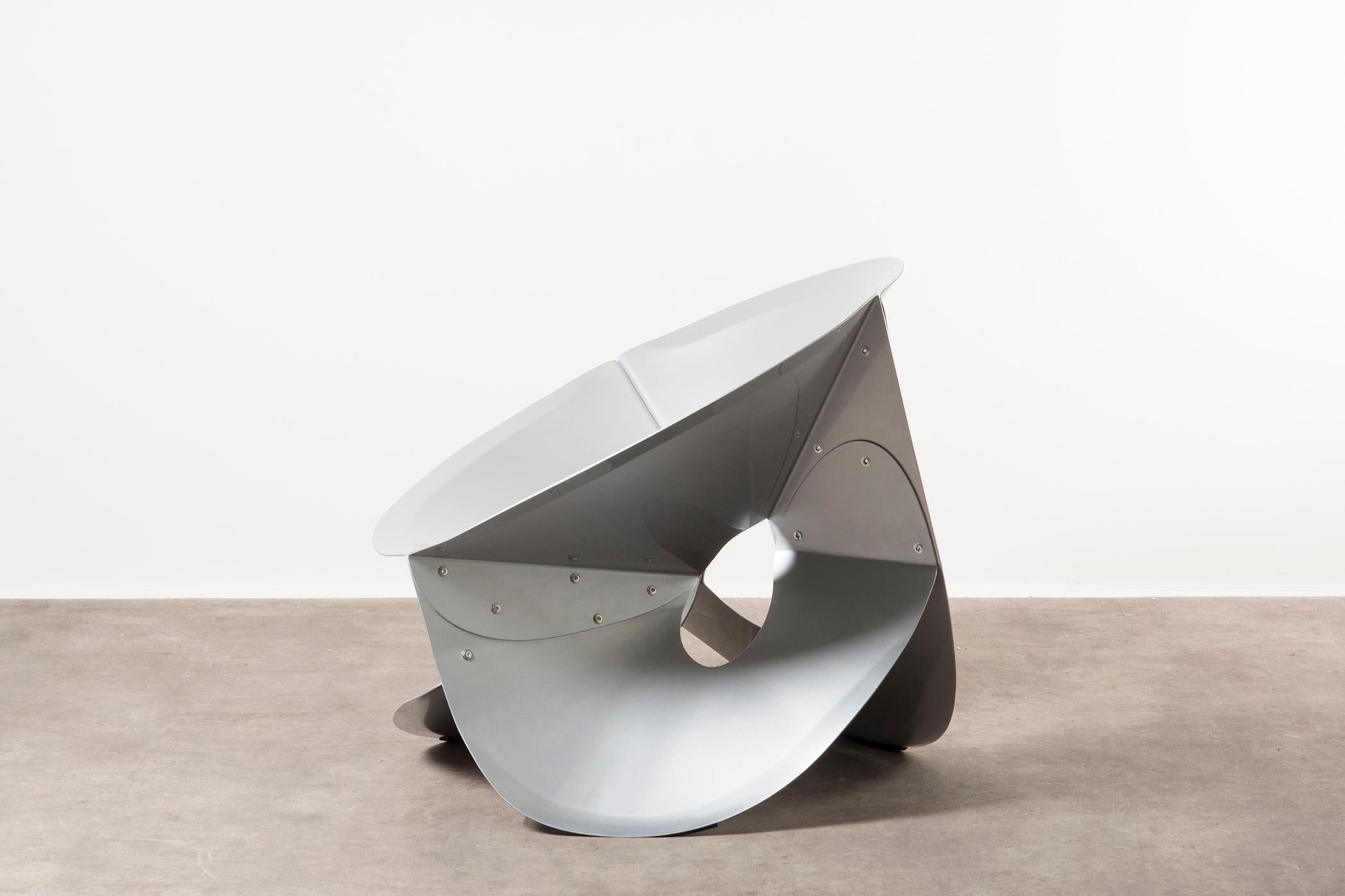 Chair Swirl by Michael Schoner, the Netherlands, 2019. Nilufar edition. Aluminum, power-coated. Measures: 90 x 84 x H 76 cm, 35.4 x 33 x H 30 in. The metal movements of Michael Schoner’s objects are extreme experiments on the theme of seating. They