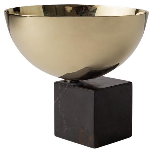 This magnificent hand-spun brass bowl over a marble piece embodies a contemporary sense of refinement and sophistication. It stands out as the ideal choice for showcasing your delectable sweets or savory delights with style and class. The brilliance