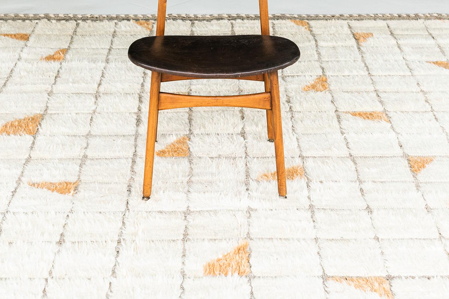 Nina' is an eclectic and modern day interpretation of the Moroccan World. It's all-over grid design, sporadic saffron yellow shapes, and unique play of textures create an exciting and one of a kind essence. This collection, 'Kust' also meaning