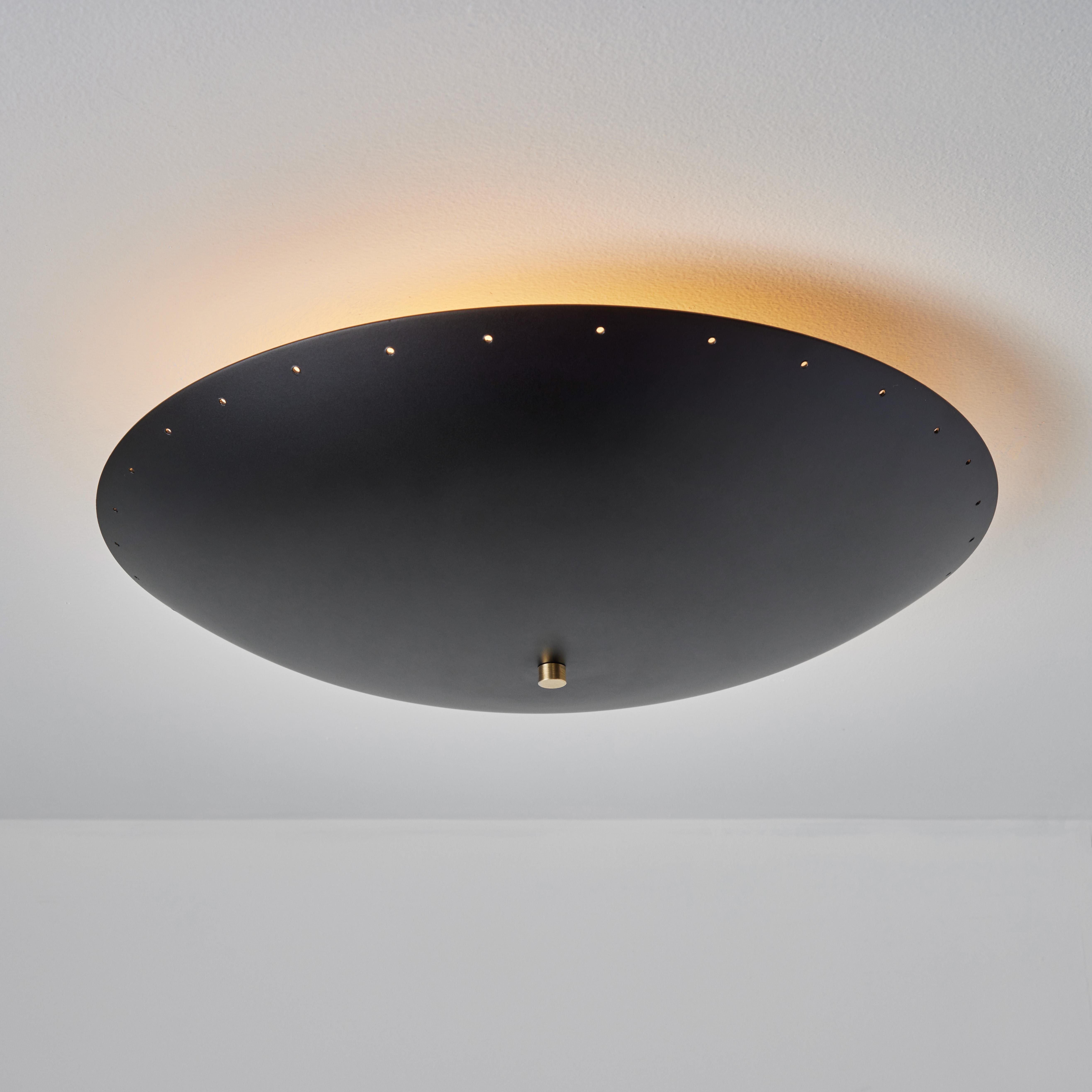 'Nina' perforated dome ceiling lamp in black by Alvaro Benitez. 

Hand-fabricated by Los Angeles based designer and lighting professional Alvaro Benitez, these highly refined table lamps are reminiscent of the iconic midcentury Italian designs of