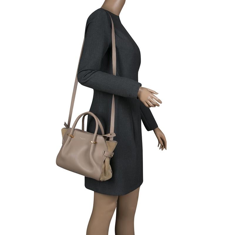 This noteworthy polished bag, crafted with leather and suede, does dual work as a fashion adornment and factual necessity. Flaunt your rich fashion taste with this Marche tote from Nina Ricci. Whether it is a casual evening or a night out with your