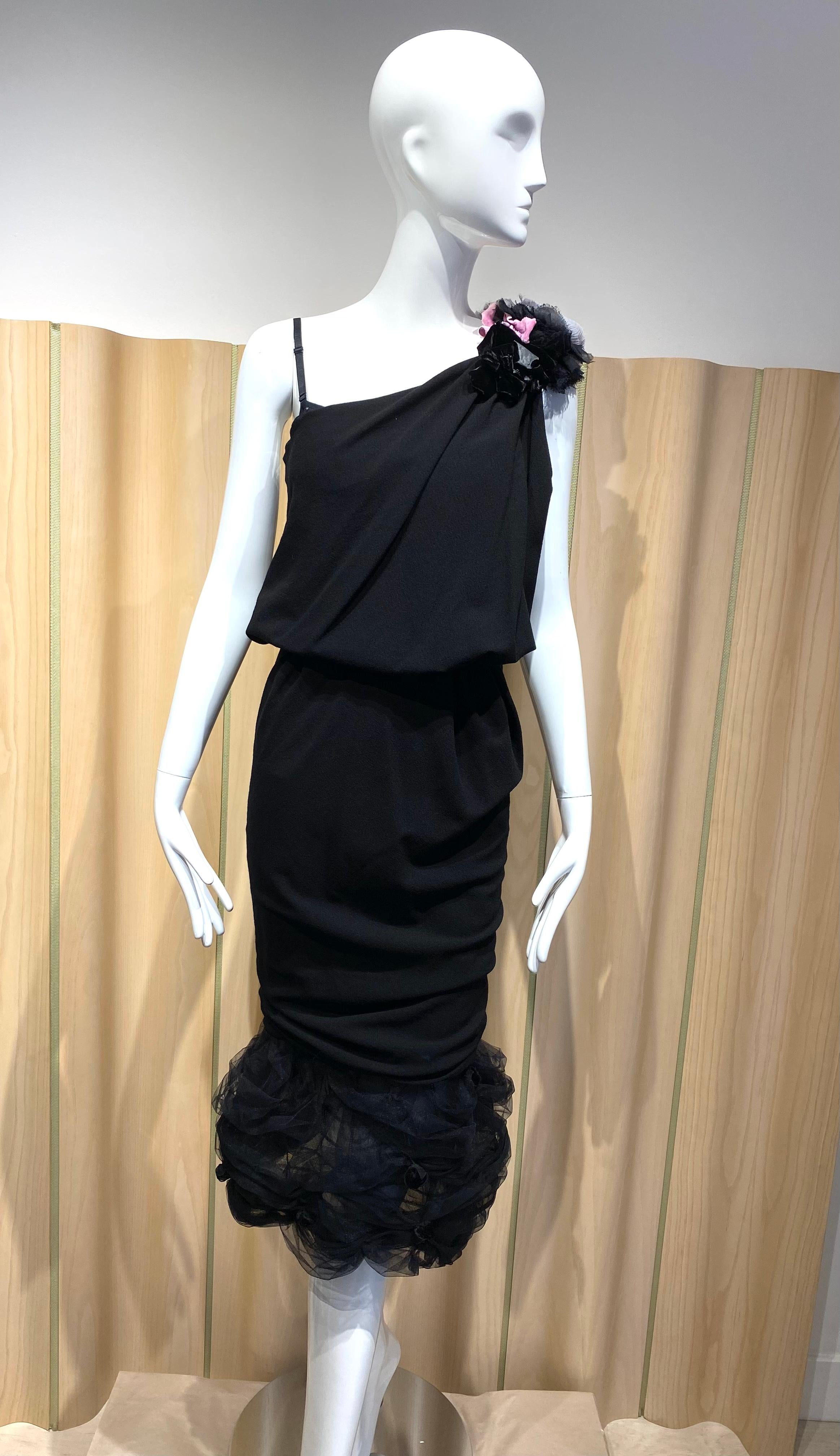 Sexy Nina Ricci Black Crepe asymmetrical fitted dress with built in corset bra and rosette.
spaghetti strap . ruching. ruffles, 
Perfect cocktail dress.
Bust fit 31” stretch to 32”/ Waist 26”. Hip 34”/ length 46’
Dress in excellent condition
