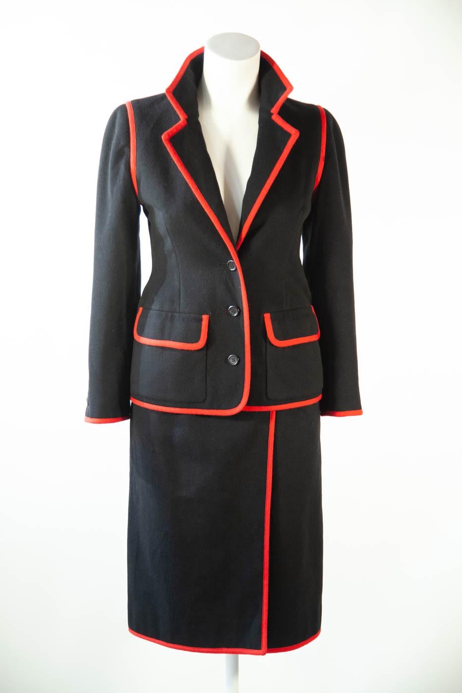 Nina Ricci black blazer and skirt with red piping, 1970's 

jacket total length- 24in.
waist- 32 in.
skirt total length- 24 in. 
hips- 30in.