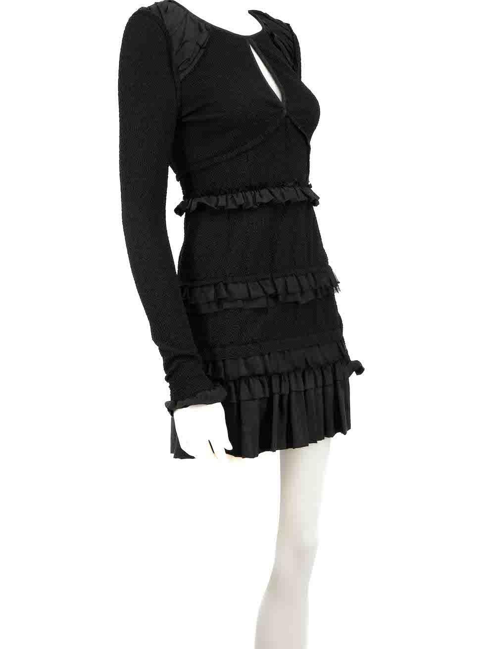 CONDITION is Very good. Minimal wear to dress is evident. Minimal fraying threads to ruffle edges on this used Nina Ricci designer resale item.
 
 
 
 Details
 
 
 Black
 
 Synthetic
 
 Dress
 
 Long sleeves
 
 Mini
 
 Front keyhole detail
 
 Ruffle