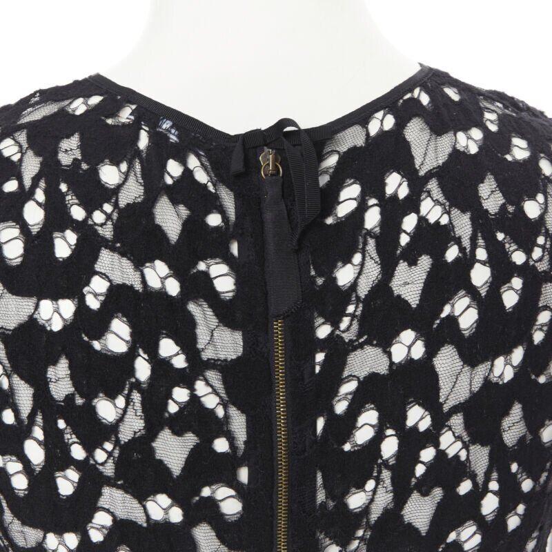 NINA RICCI black sheer lace cap sleeve zip back T-shirt top FR40 XS
Reference: LNKO/A01830
Brand: Nina Ricci
Model: Lace top
Color: Black
Pattern: Solid
Closure: Zip
Extra Details: Zip back closure.
Made in: France

CONDITION:
Condition: Excellent,