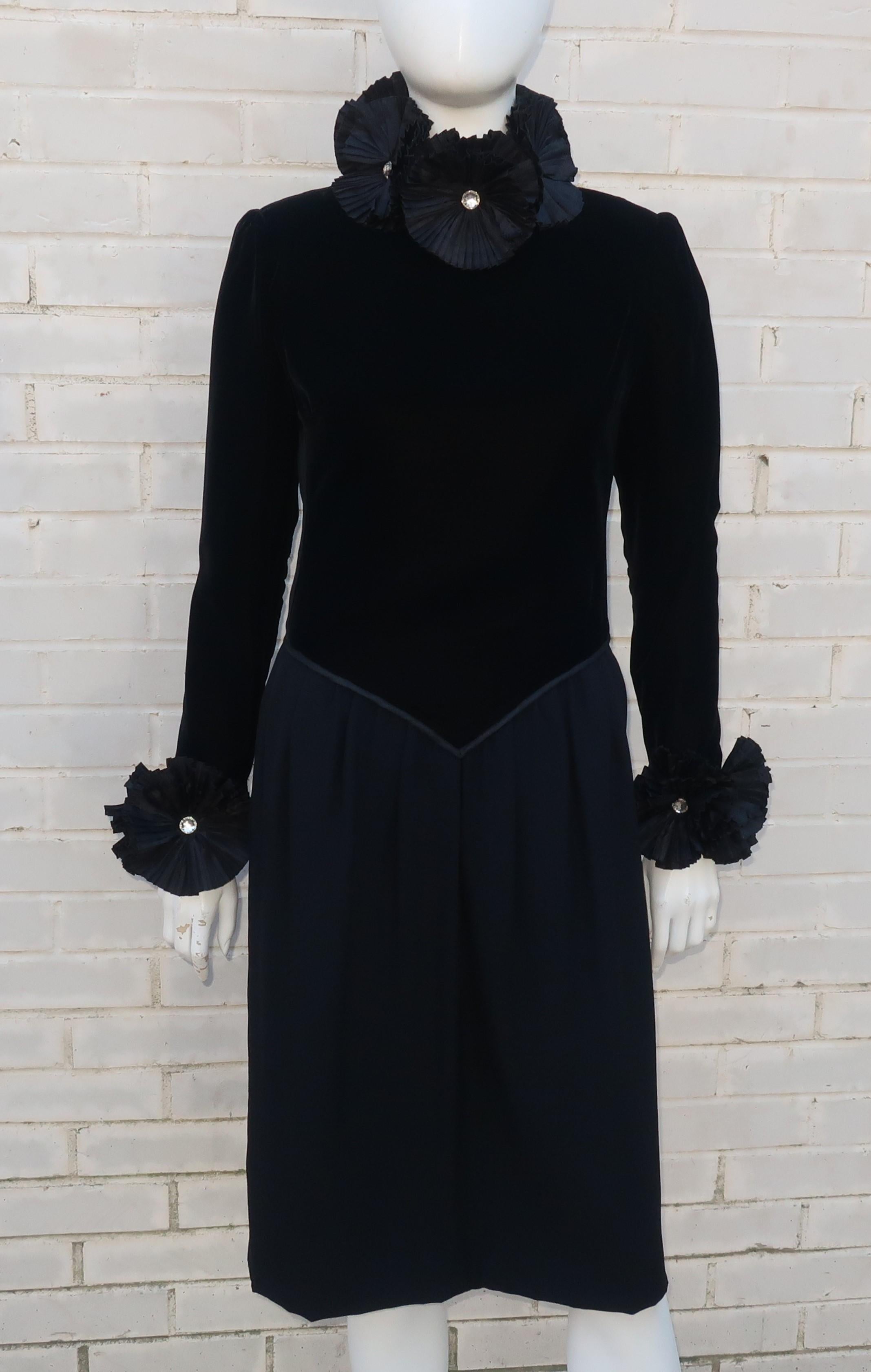 This C.1980 Nina Ricci Haute Boutique black cocktail dress offers an austere femininity with the addition of the modern version of an Elizabethan ruff collar.  The velvet bodice is structured in an elegant way providing an excellent foil for the