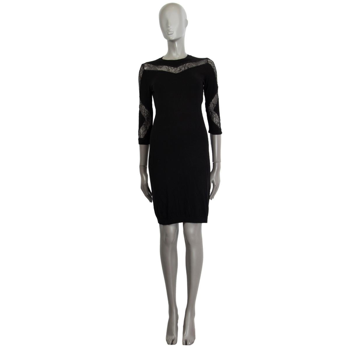 100% authentic Nini Ricci wool-blend dress in black wool (70%) cashmere (30%) with a lace-detail around the chest and along the arms, crew neck, 3/4 arm length, ribbed cuffs and hem. Unlined. Has been worn with some usage signs makes overall a good