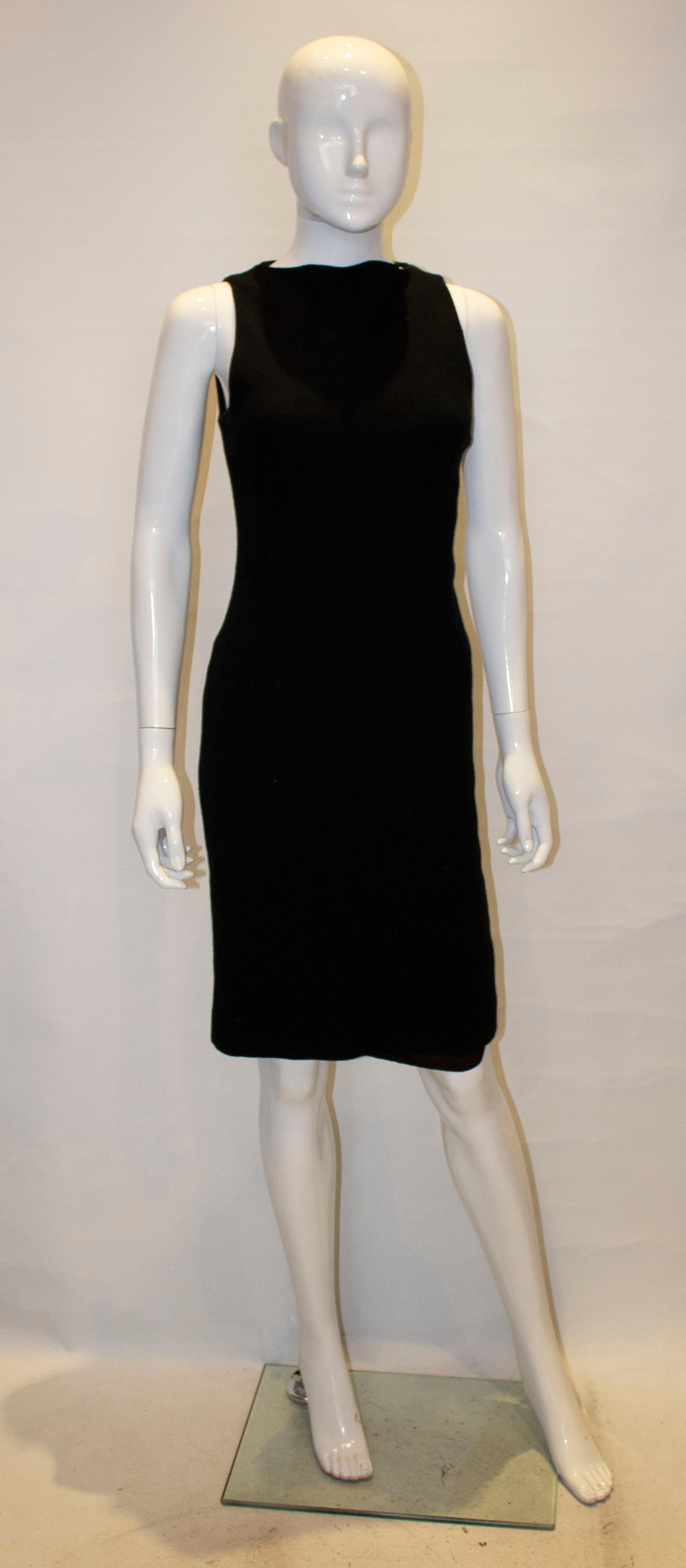 A chic black wool shift dress by Nina Ricci, Paris. The dress is 100% wool, and fully lined.