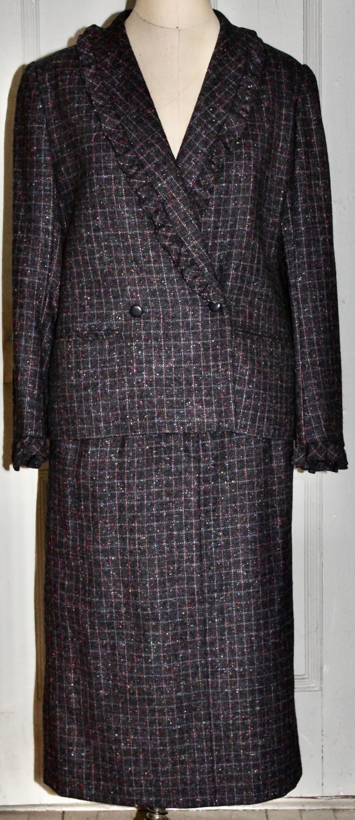 Nina Ricci purple wool tweed double breasted skirt suit, fabric imported from Ireland.
Ruffled edging on collar and sleeve cuffs. Nina Ricci Boutique Bloomingdales labels.
Jacket length 27
