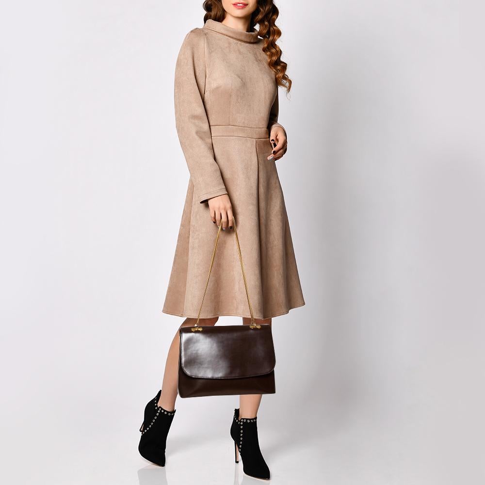 A structured and compact crossbody bag can assist you with many outings and can be styled with most of your attires. Nina Ricci's bag is an example of the label’s penchant for creating staple pieces. It is crafted from leather in a brown shade and
