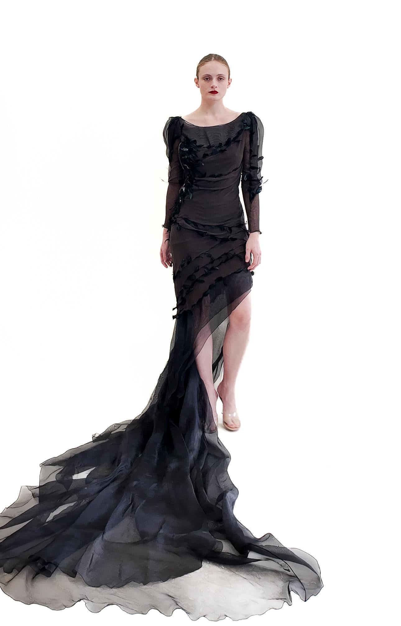 Indulge in the ultimate luxury with the Nina Ricci by Olivier Theyskens Spring 2009 Brown Gown. This exquisite runway sample features a beautiful brown fabric adorned with delicate feathers and chiffon, accented by elegant zippers. Elevate your