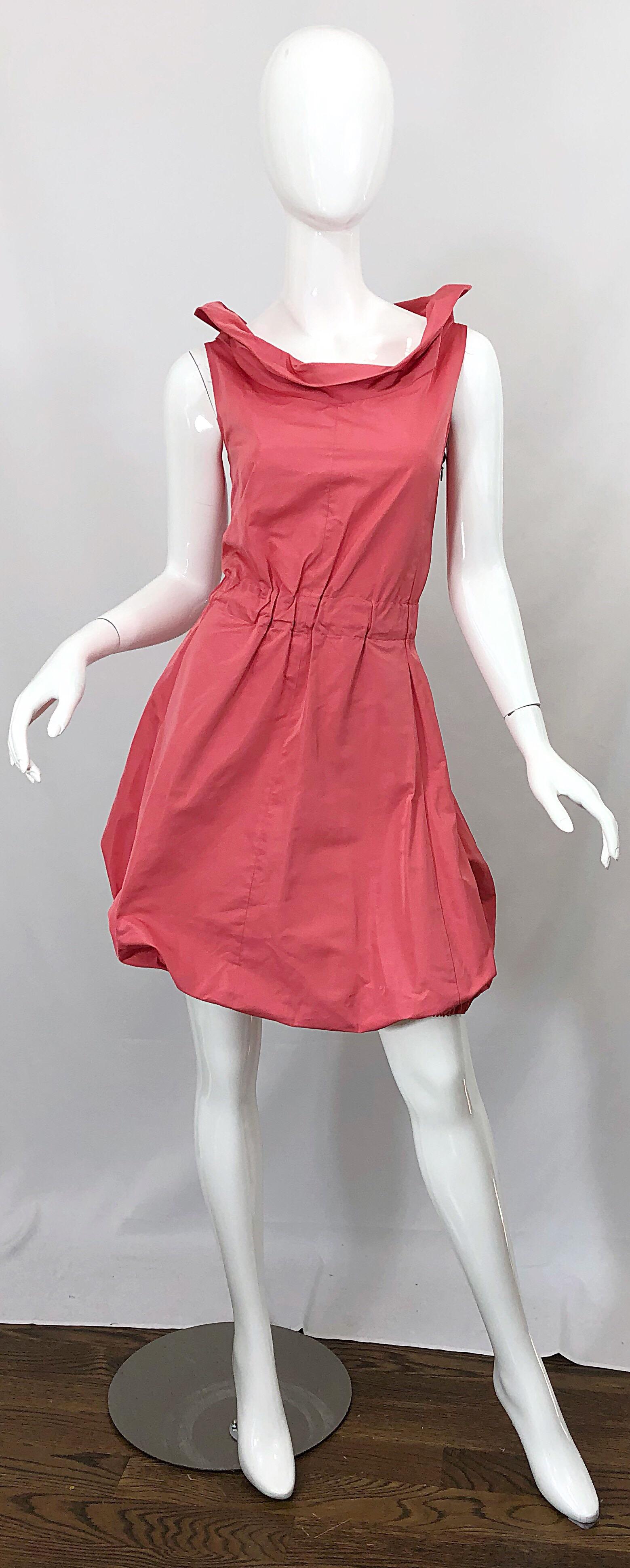 Avant Garde vintage NINA RICCI early 2000s exclusively for Saks 5th Avenue coral / pink silk blend. Flattering cowl neck with a fitted bodice. Forgiving full bubble skirt. Hidden zipper up the side with hook-and-eye closure. Elastic waistband. Great