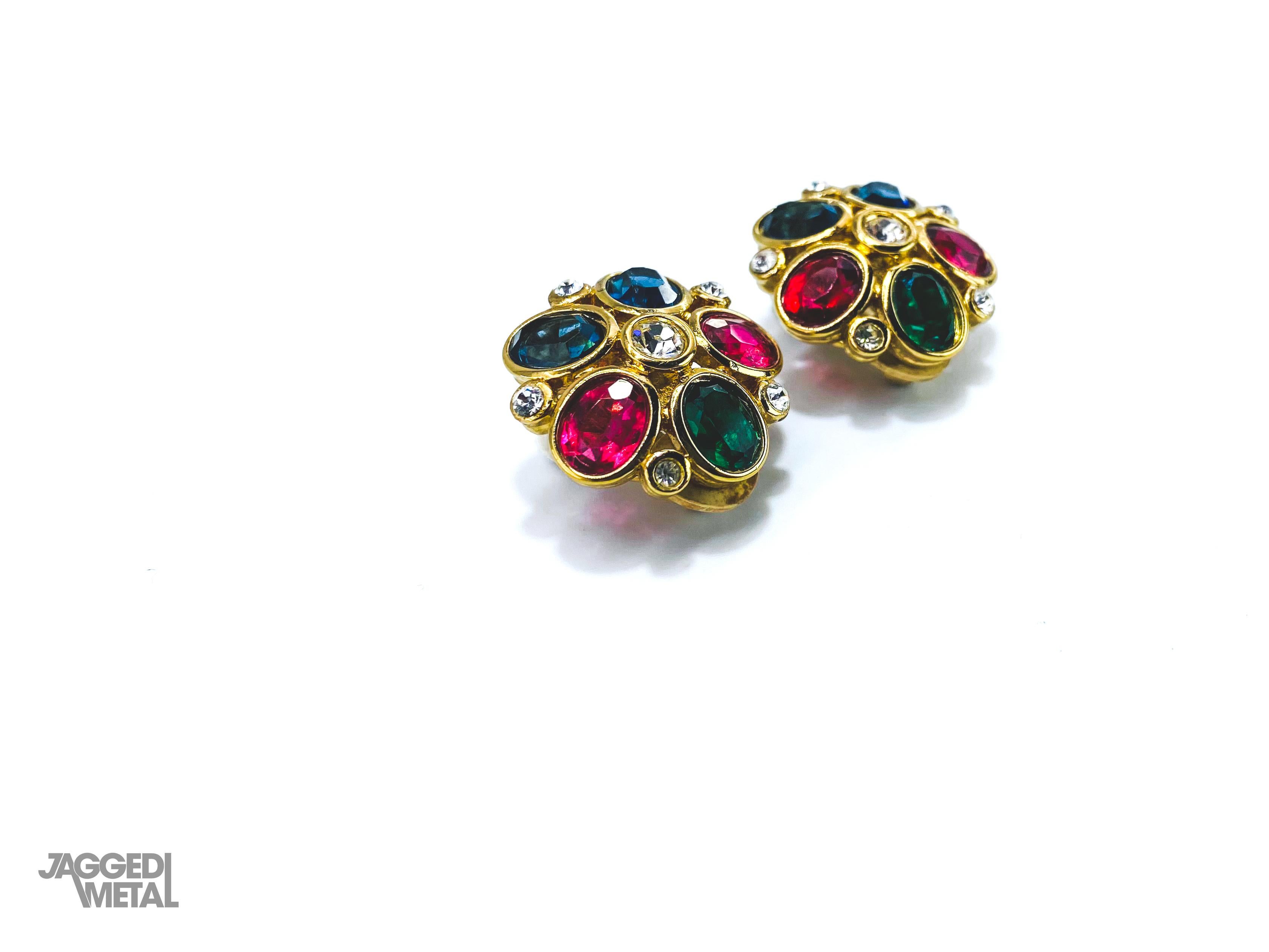 Nina Ricci 1980s Vintage Clip On Earrings 

Detail
-Made in France in the 1980s
-Set with pink, blue and green cabochons and tiny crystals  
-Crafted from gold plated metal

Size & Fit
-Approx 0.75 inches across
-Strong, comfortable