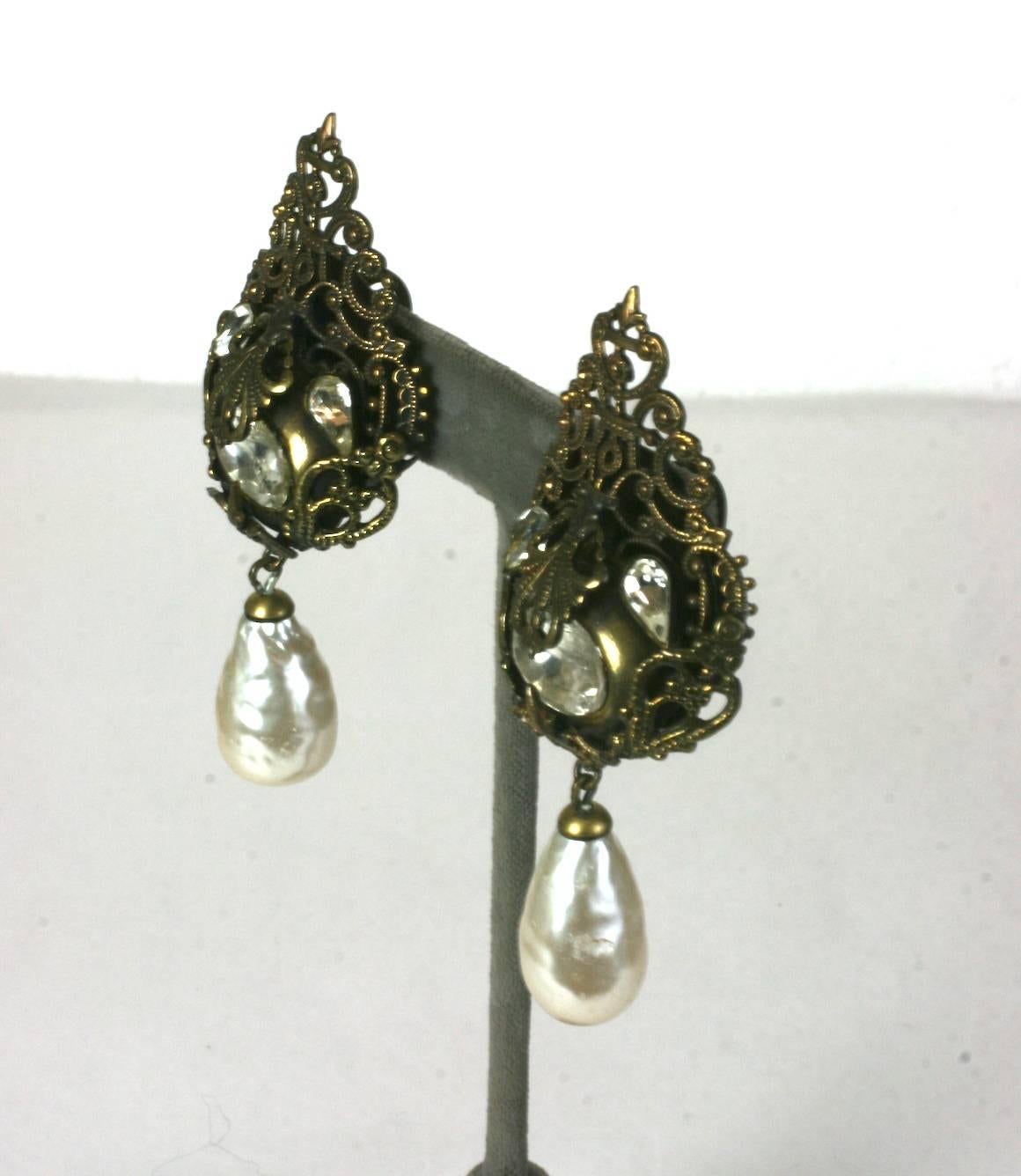 Large Nina Ricci French Haute Couture long pendant ear clips. Of antique bronze filigree, round and teardrop faceted crystal pastes with faux pearl tear shape drops. 
Unsigned. France 1980's. 
Made in France. Excellent condition. 
Length 3